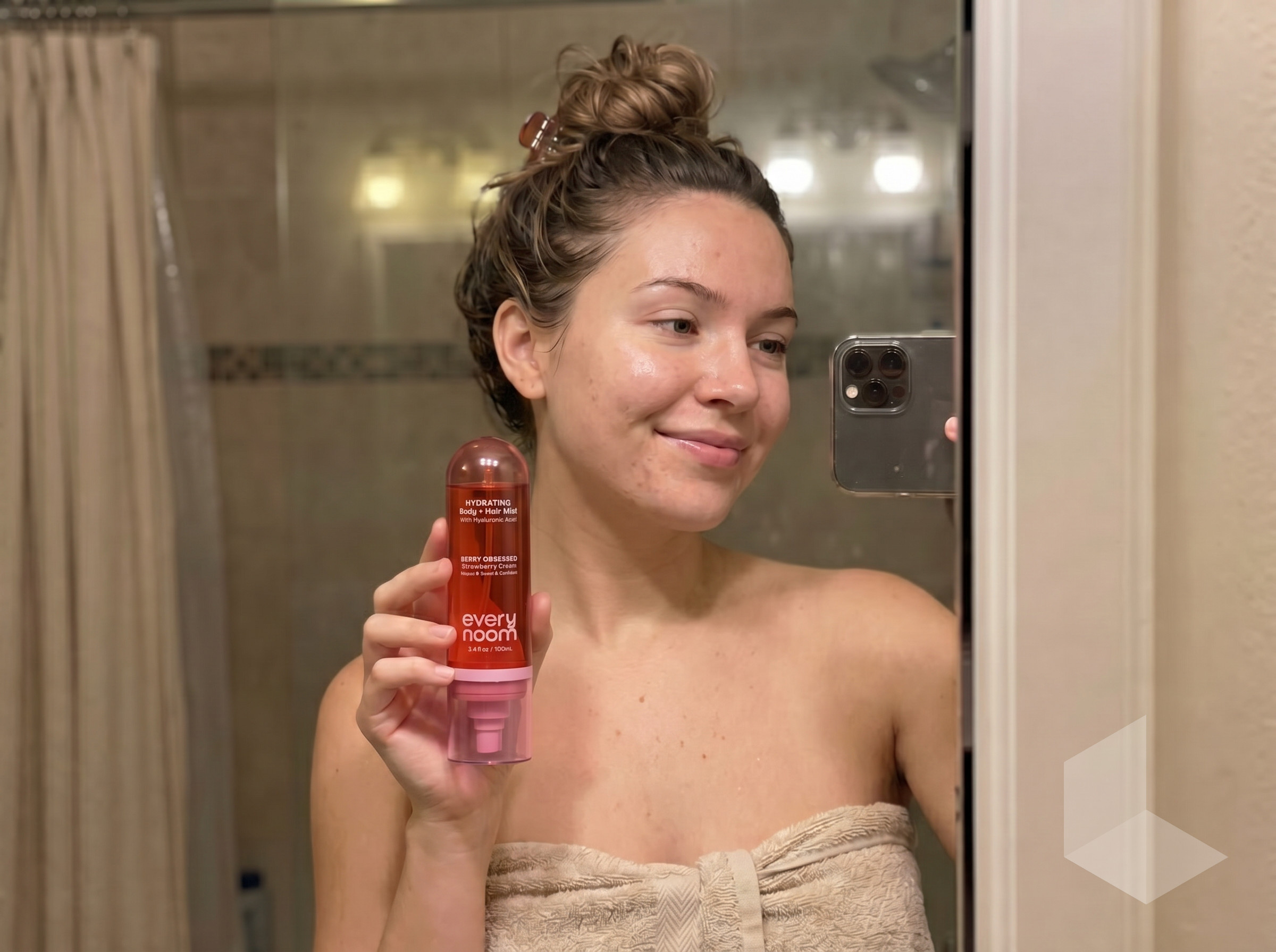Katie M. customer review — bathroom mirror selfie holding Berry Obsessed