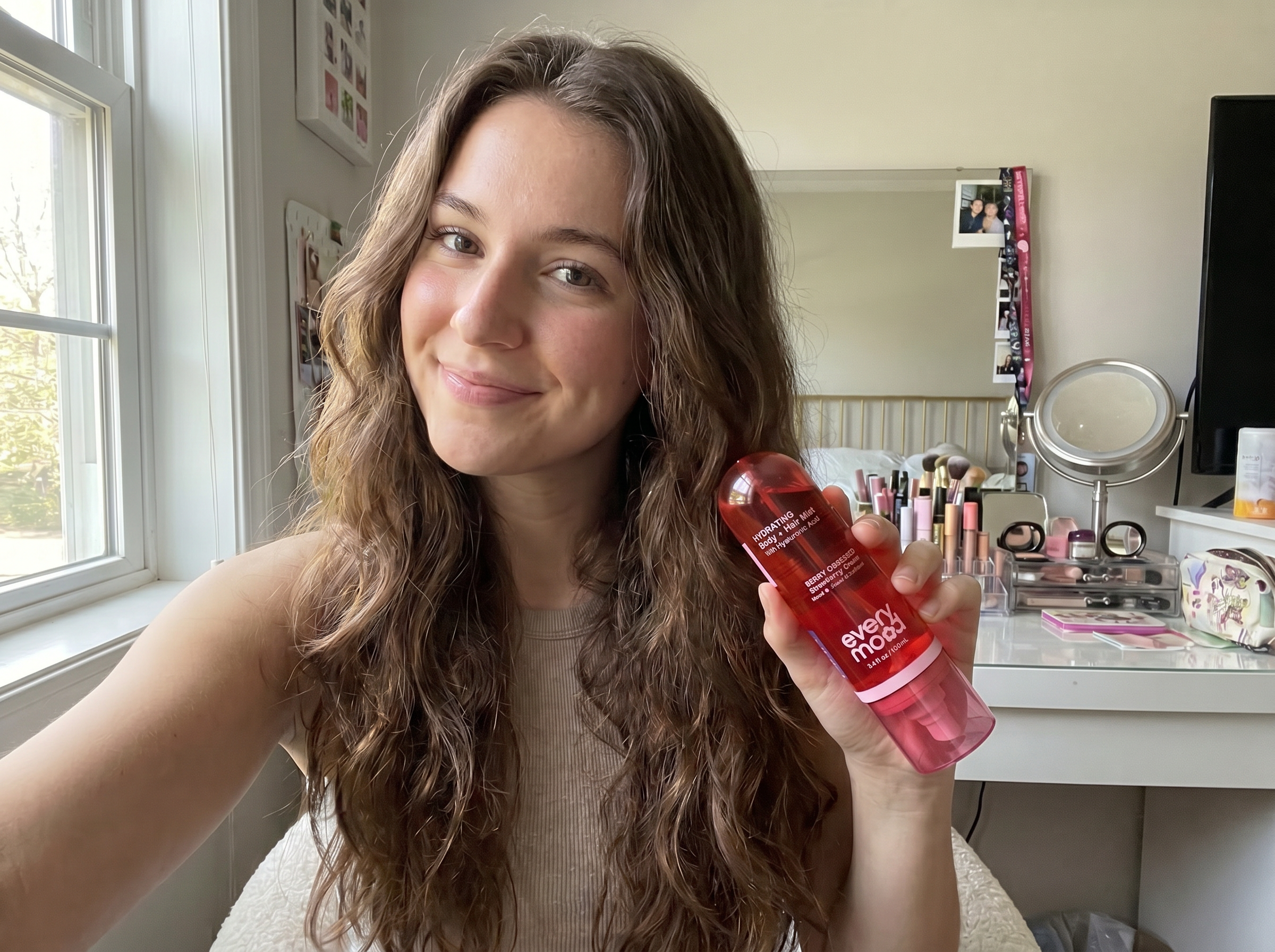 Stephanie R. customer review — holding Berry Obsessed in her bedroom