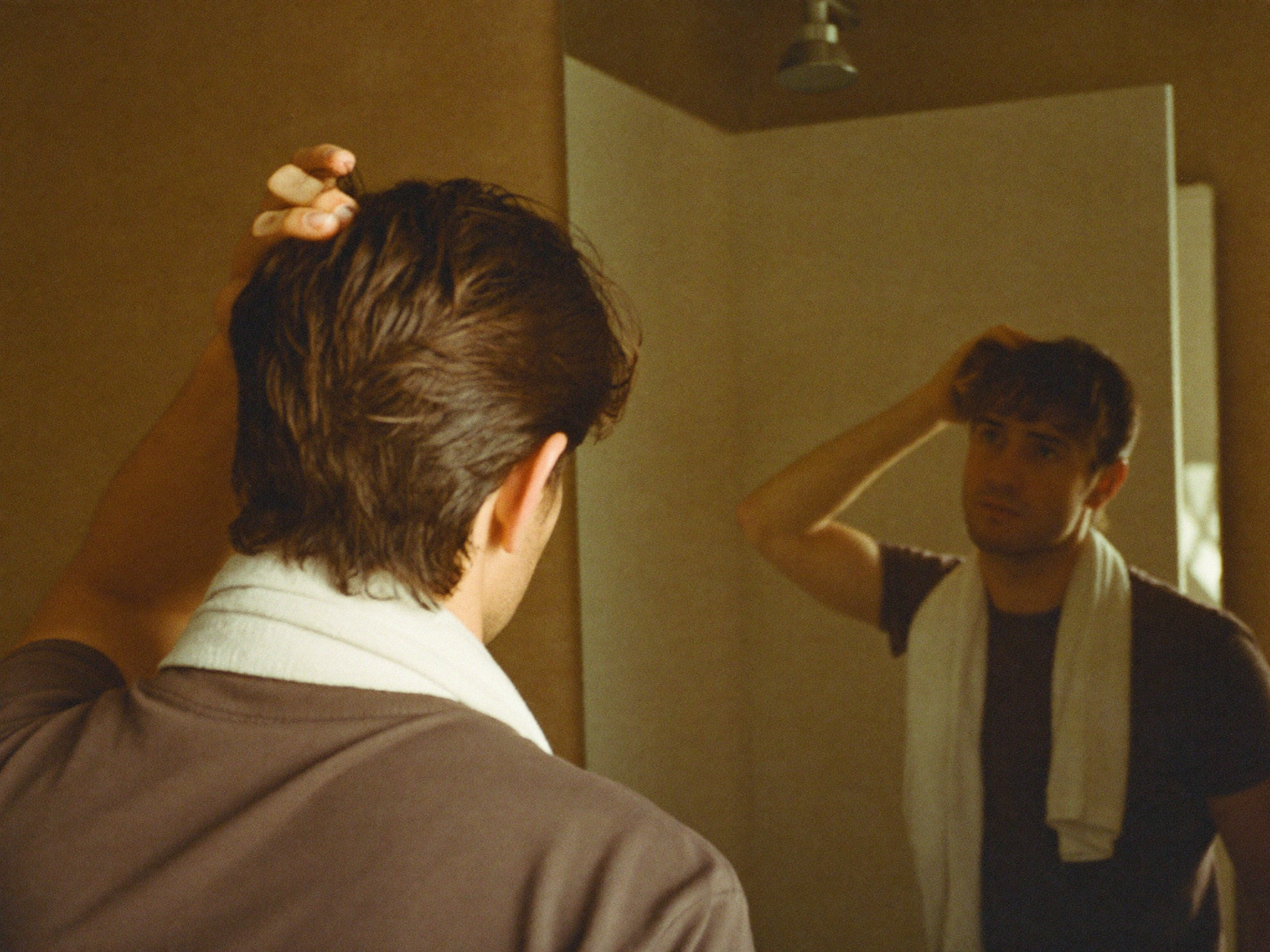 Towel-dried hair at the bathroom mirror, ready for hair clay
