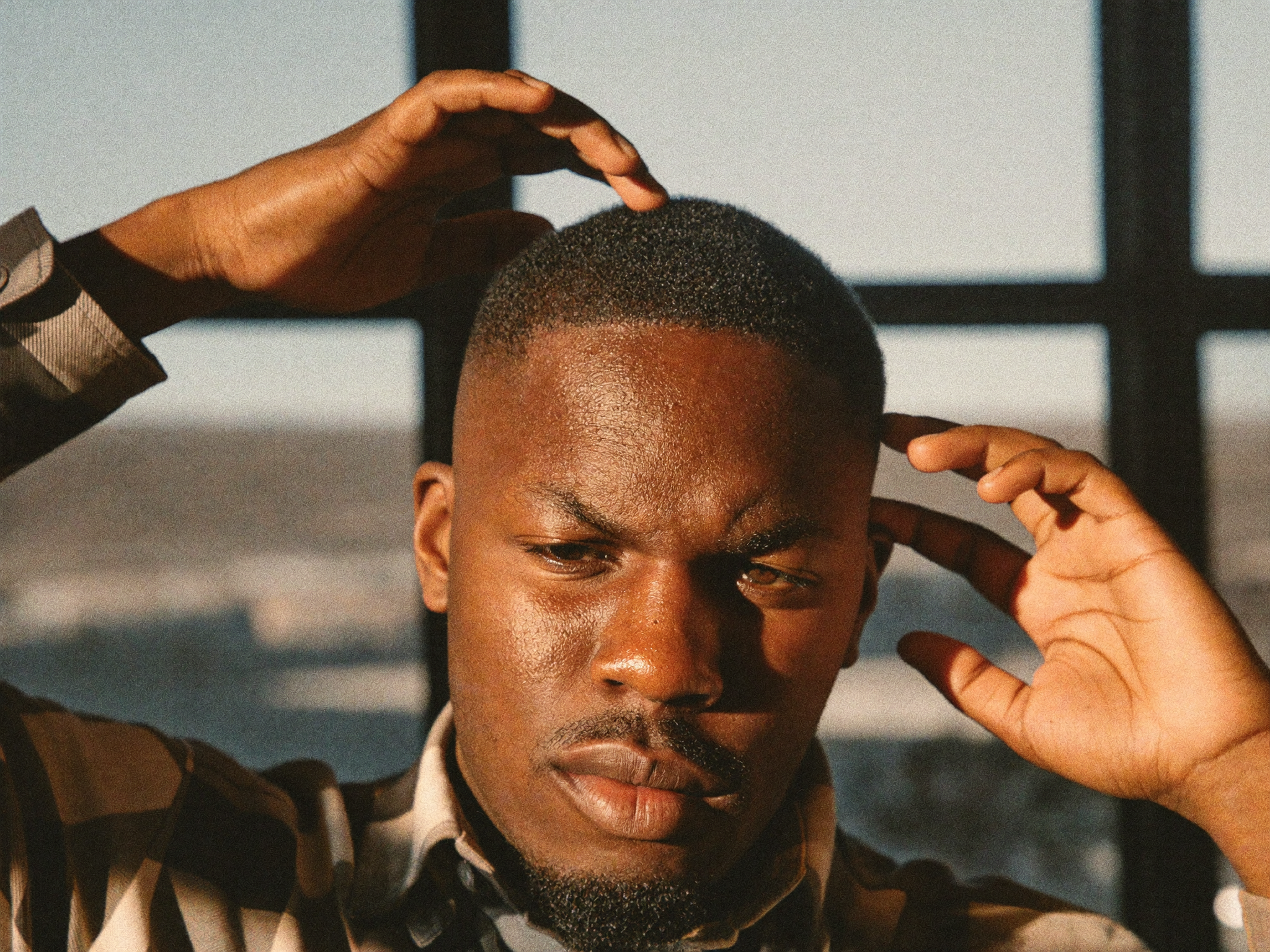 Finished textured crop with an ultra-matte finish in warm barbershop light