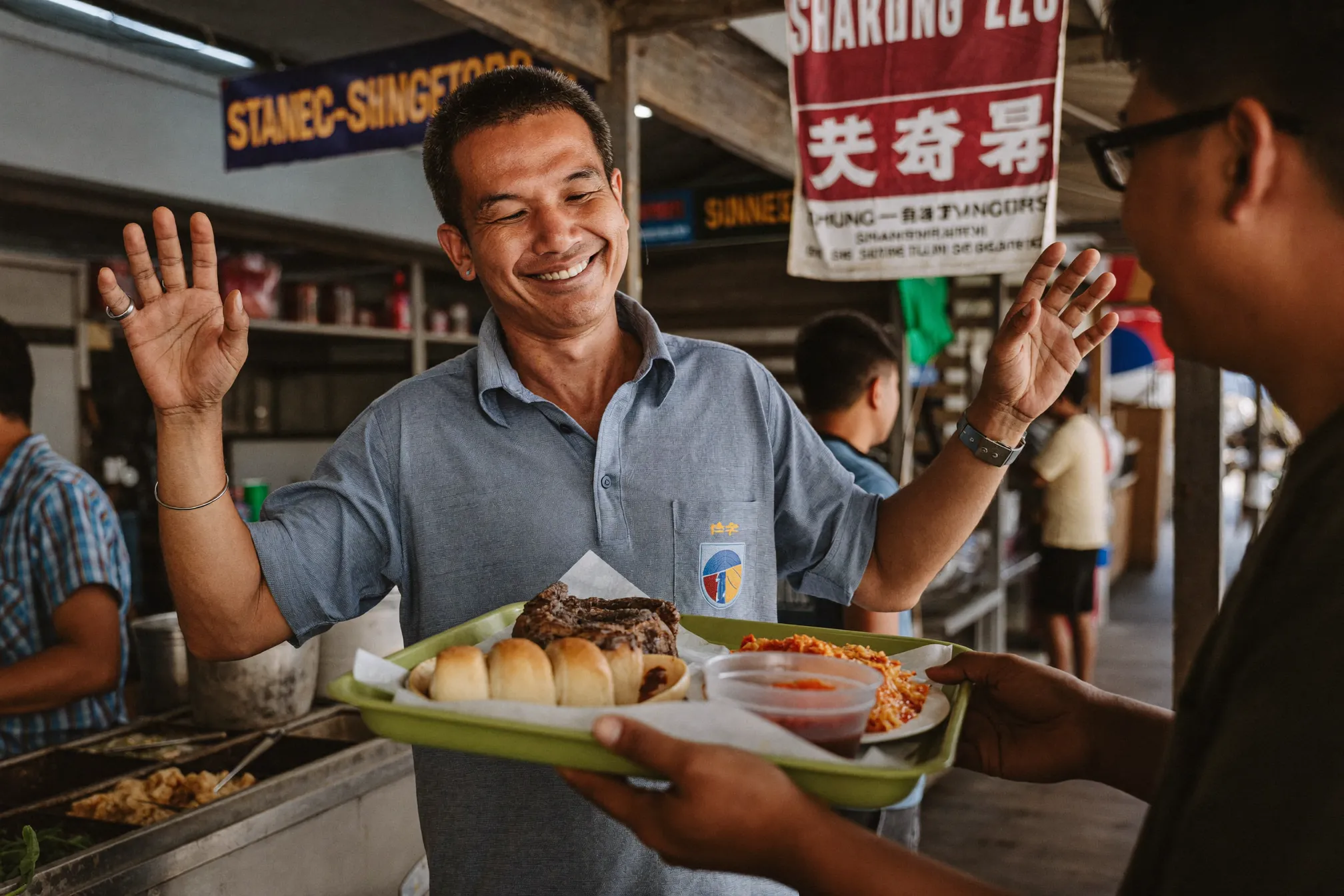 A worker confidently ordering food at a Singapore hawker centre