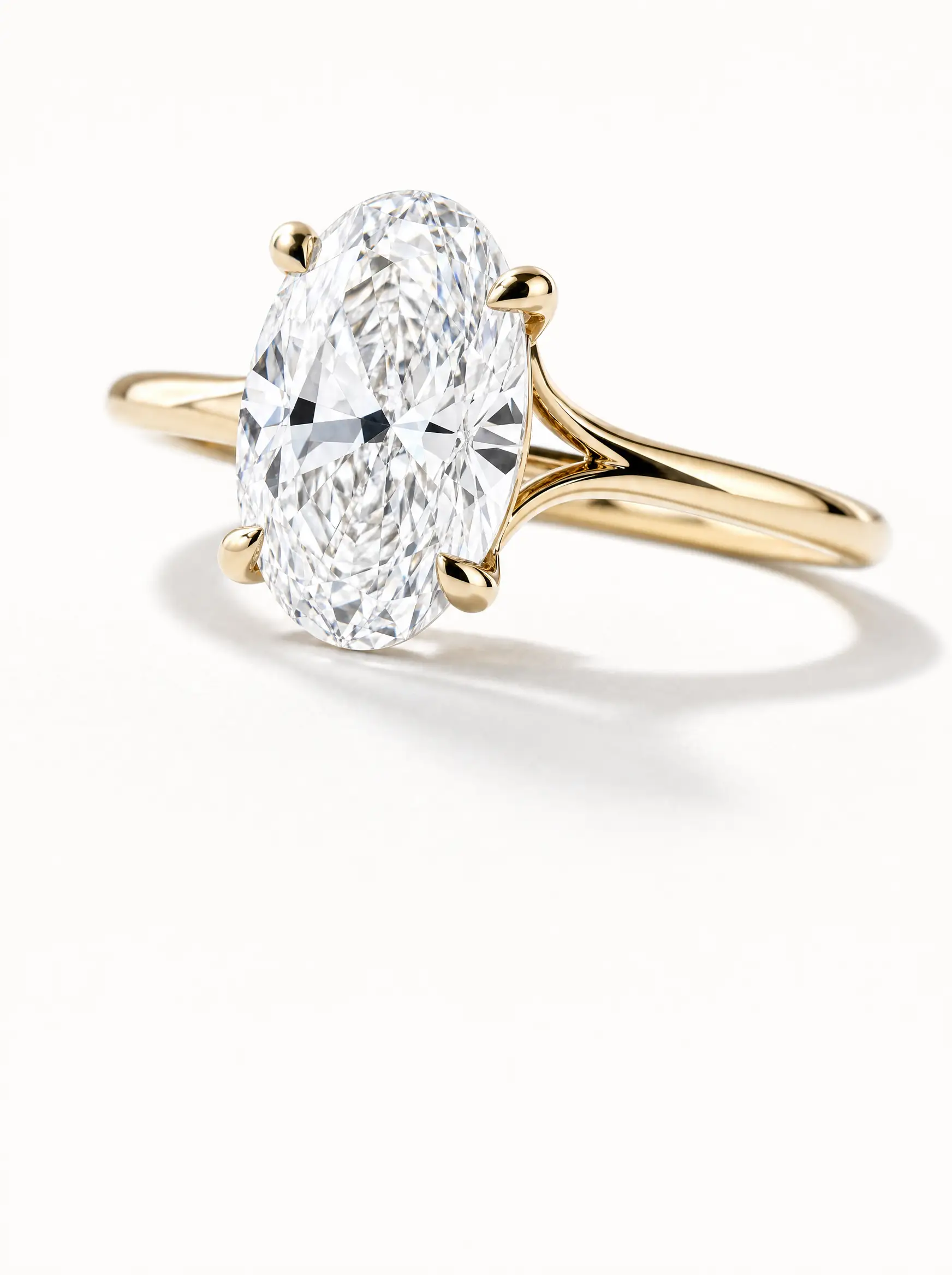 Oval diamond engagement ring in yellow gold