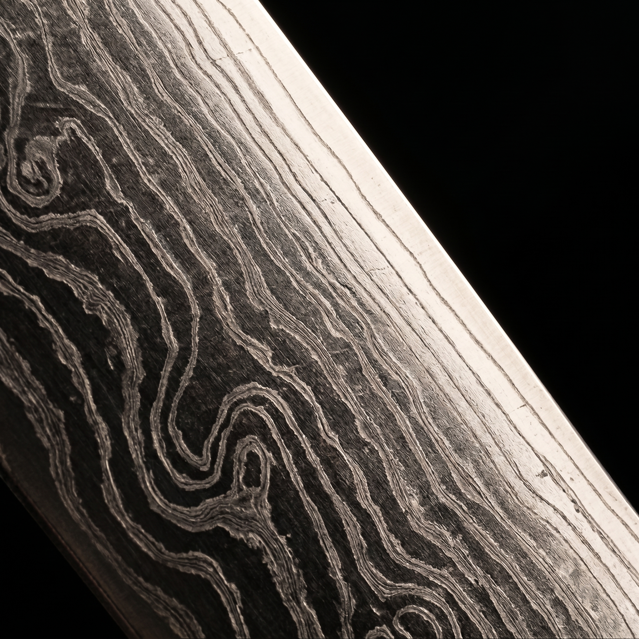 67-layer Damascus steel pattern close-up, hand-forged blade detail