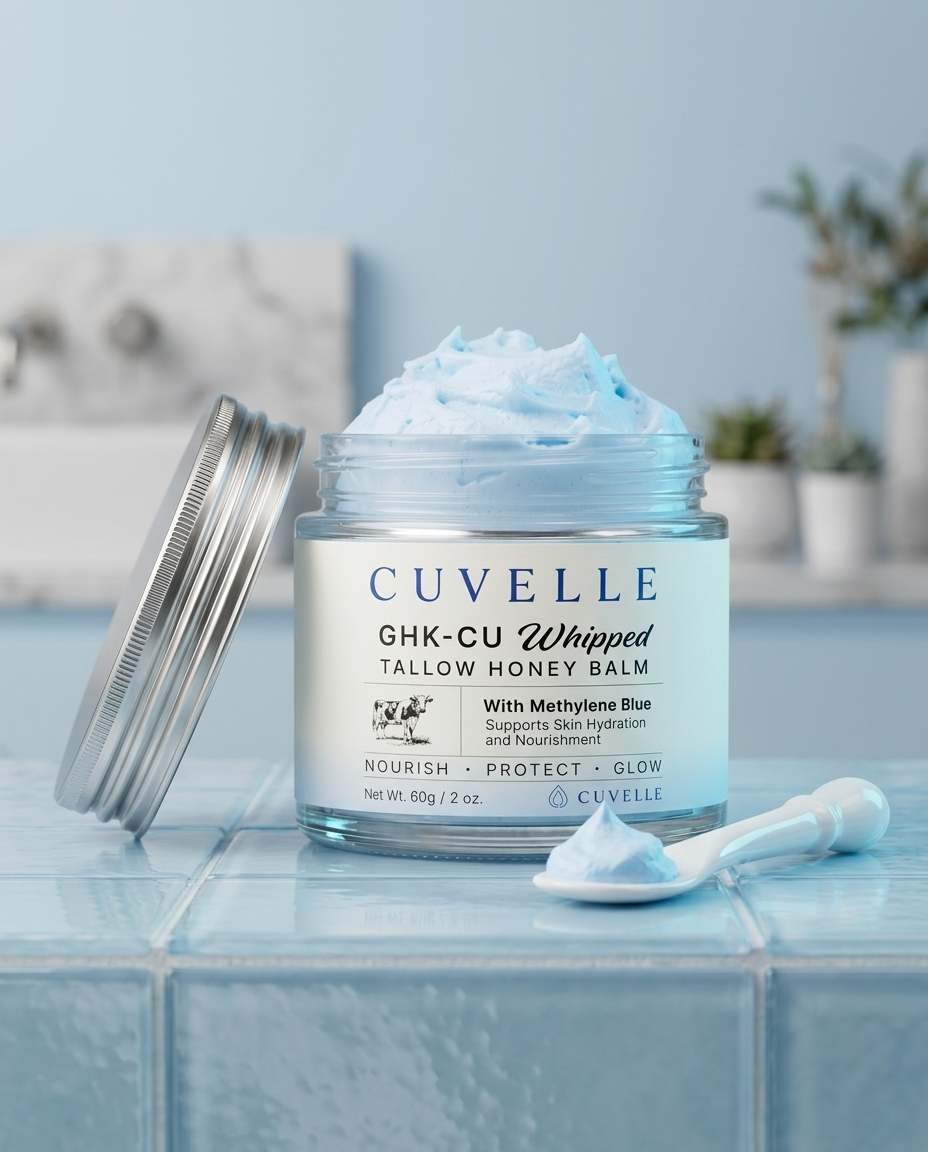 Cuvelle whipped tallow balm jar with sky-blue balm on a spatula.