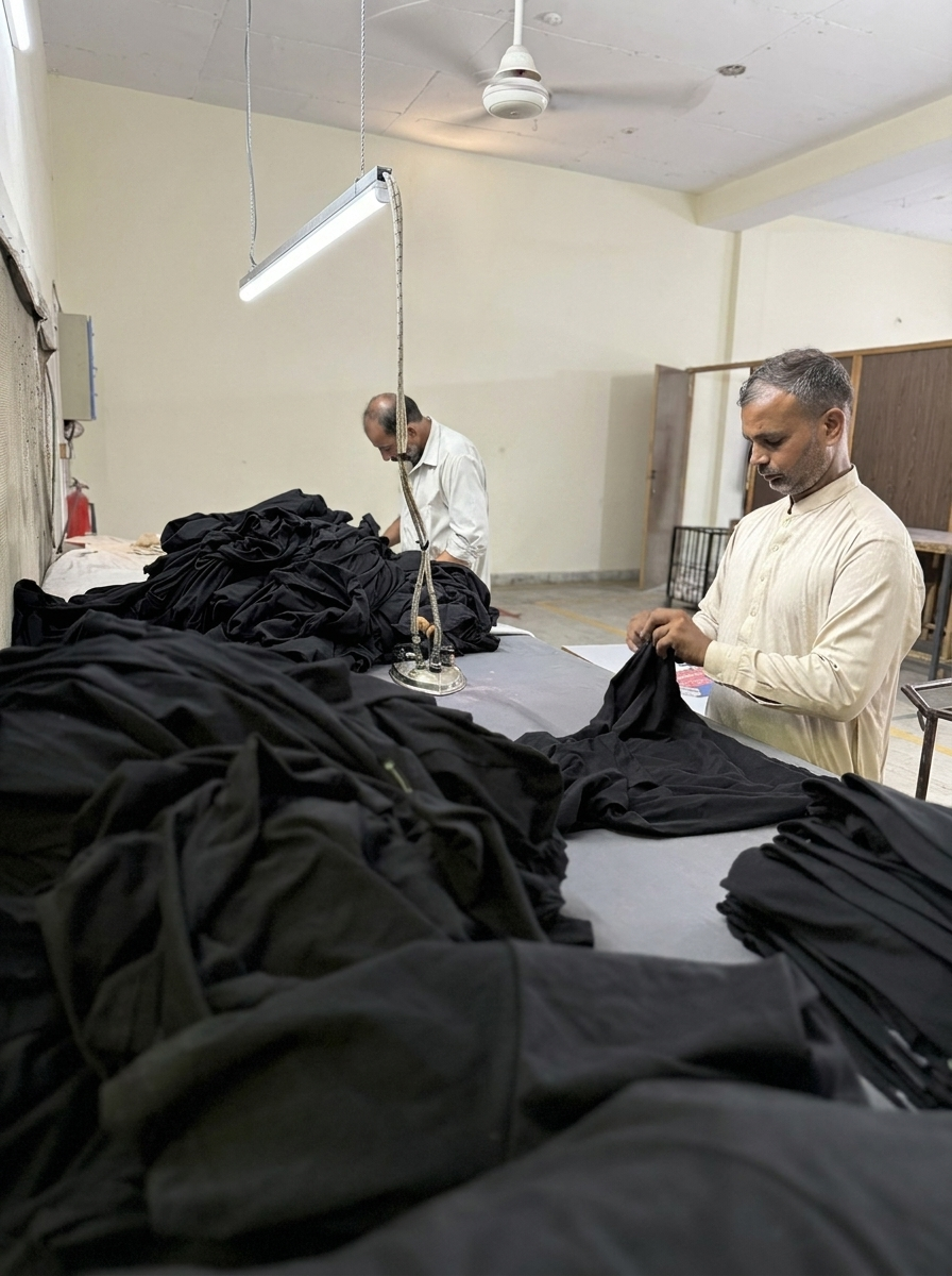 Industrial steam pressing of knit garments at SAS Agencies