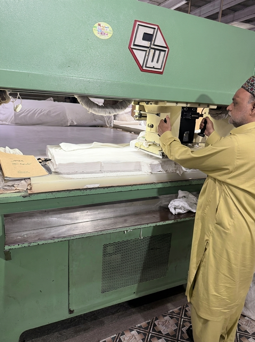 Hydraulic die cutting press for cotton glove panels at SAS Agencies