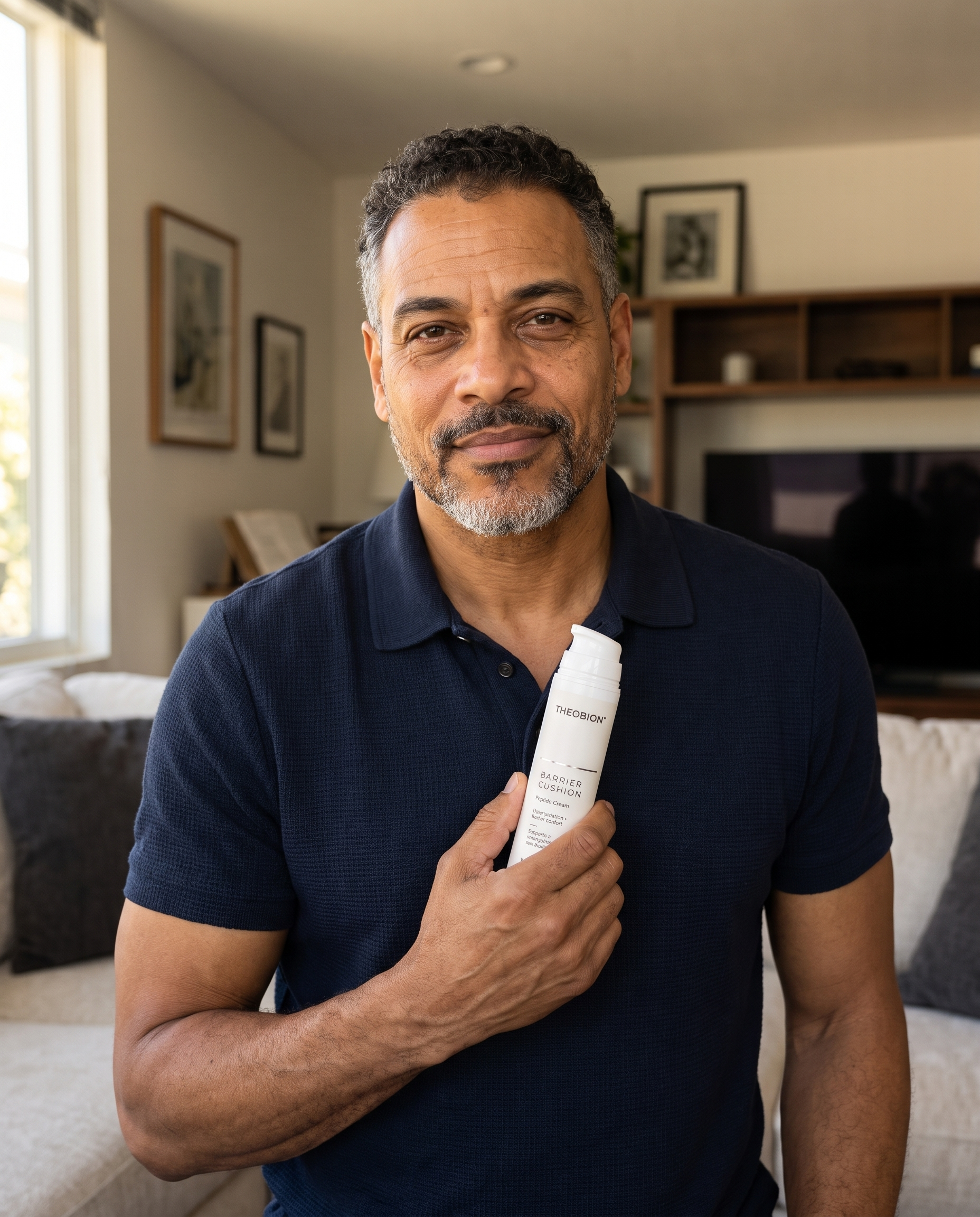 Man holding Theobion Barrier Cushion Peptide Cream