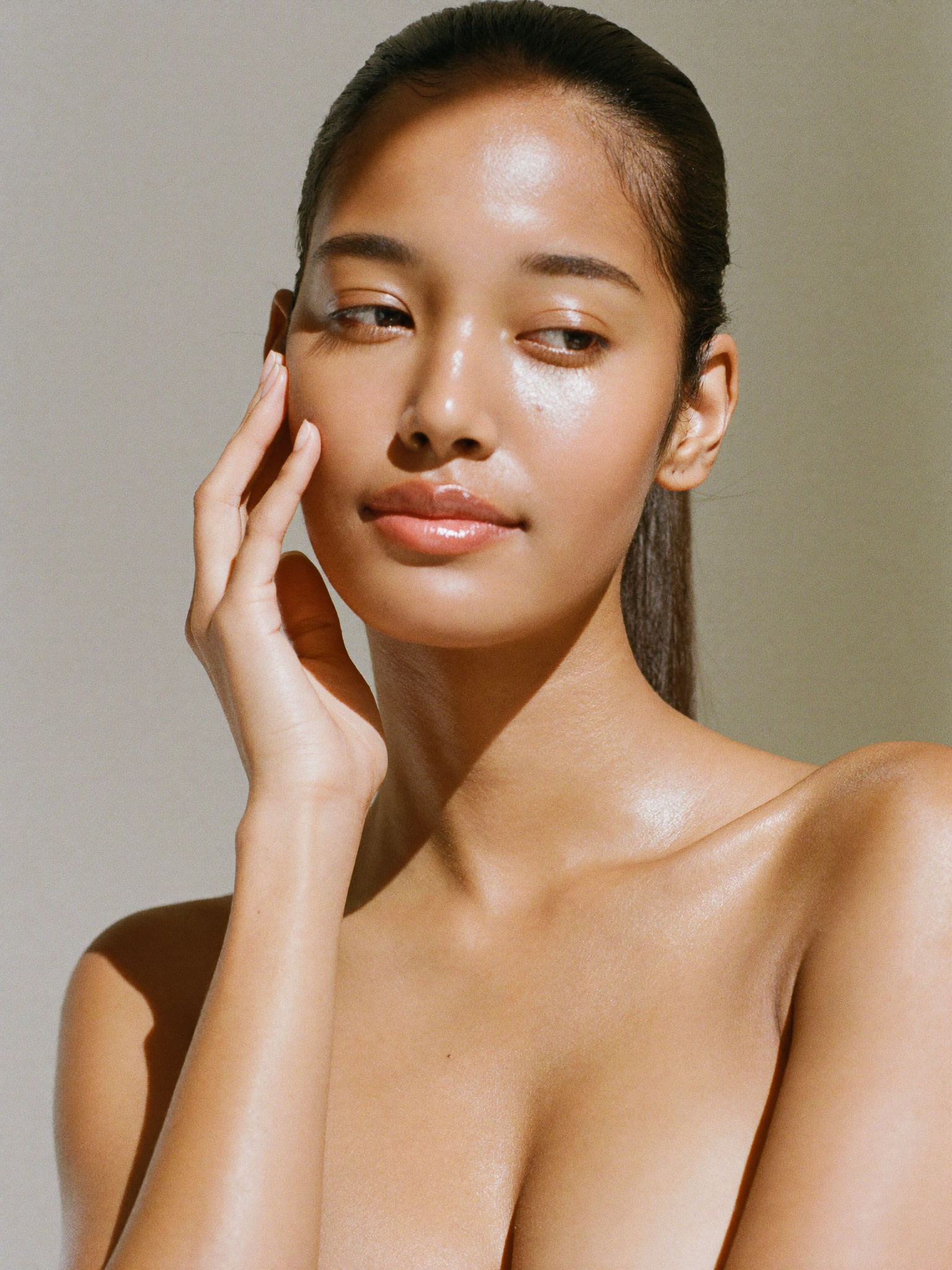Client with glowing skin after a facial treatment