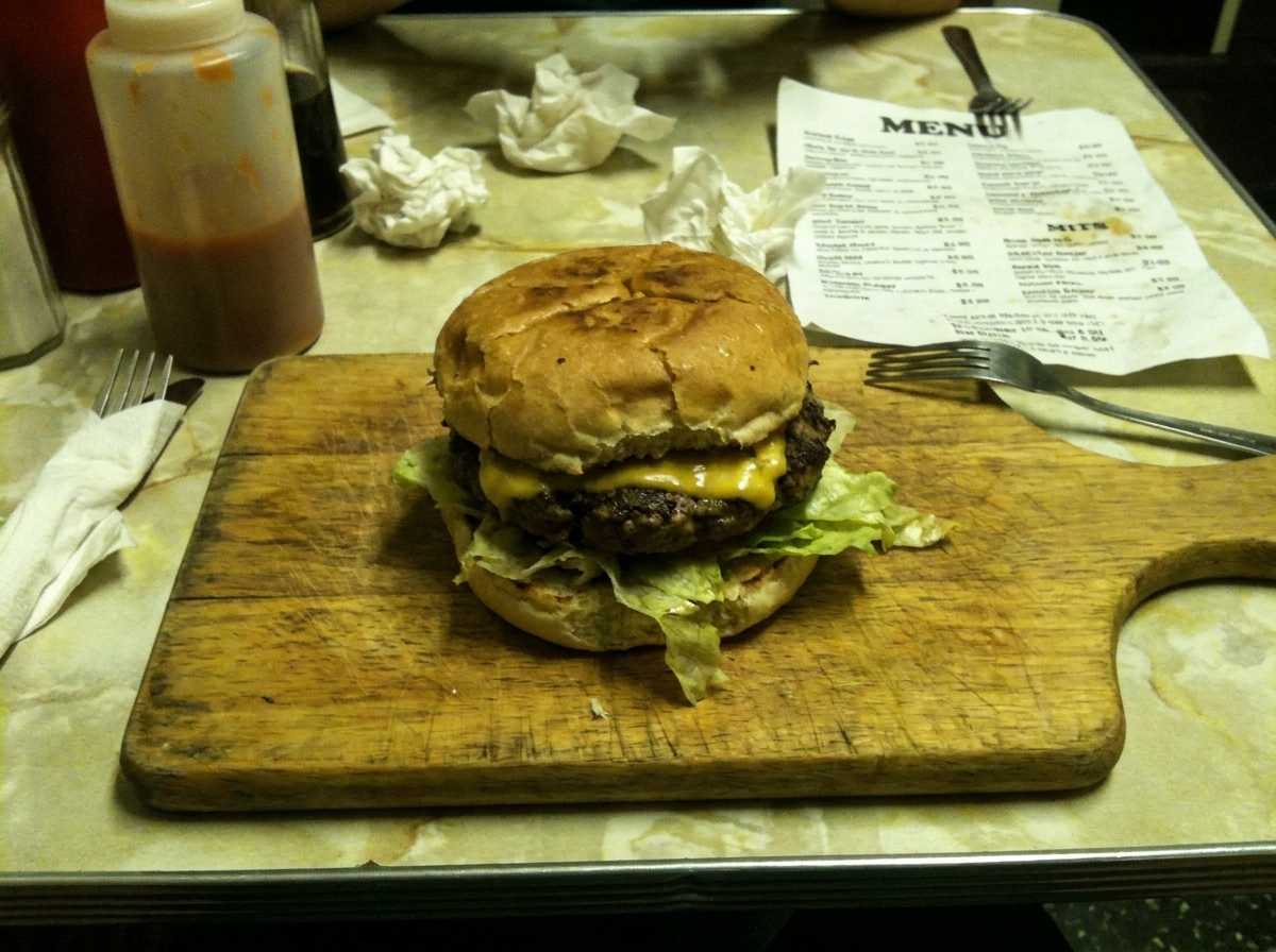 Typical smartphone photo of a burger in poor lighting