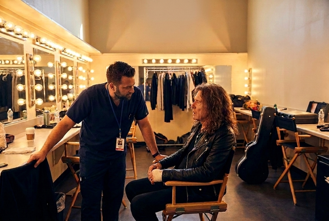 A nurse checking on a lead singer in the backstage dressing room before a show