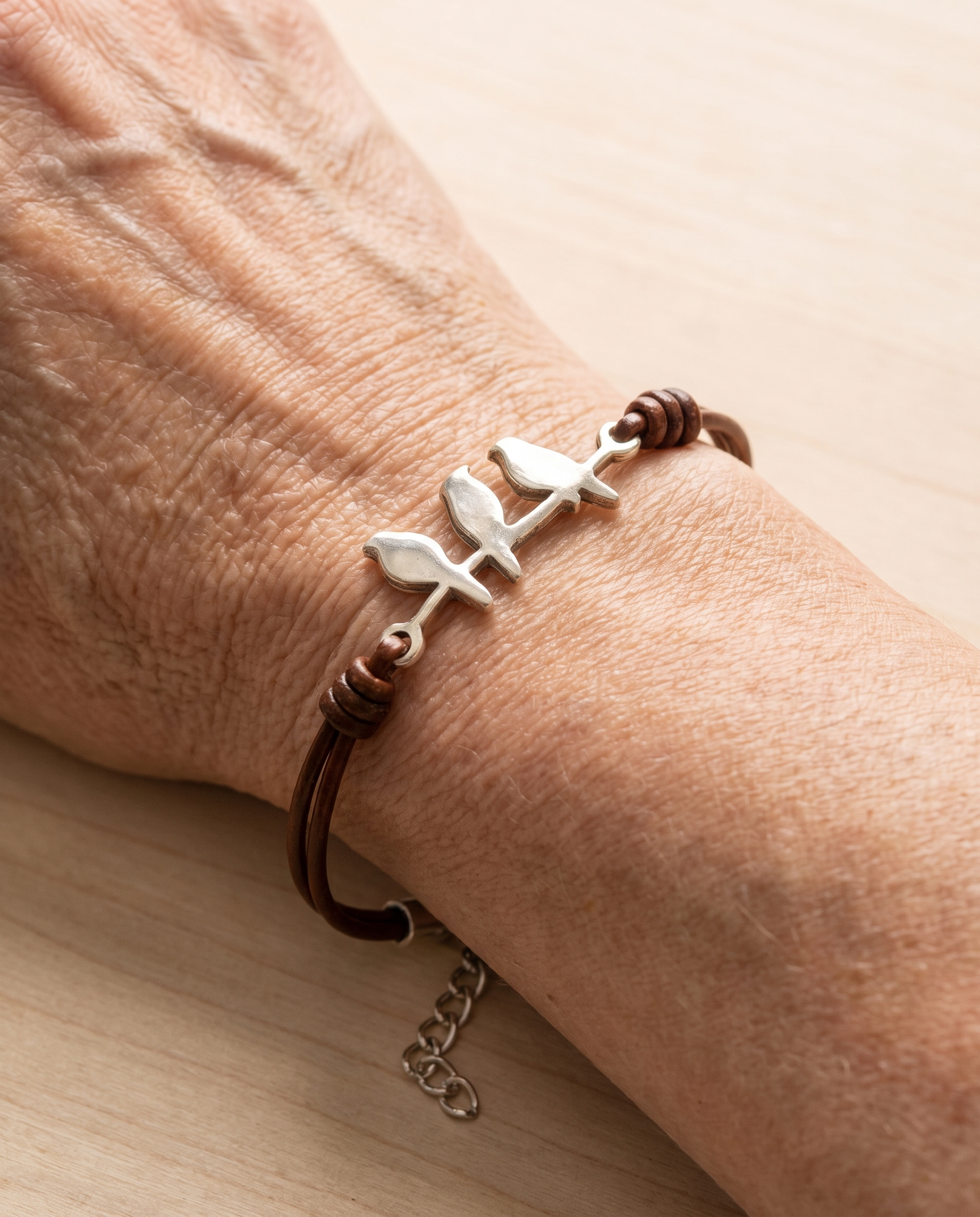 Bird Branch Leather Bracelet worn on the wrist