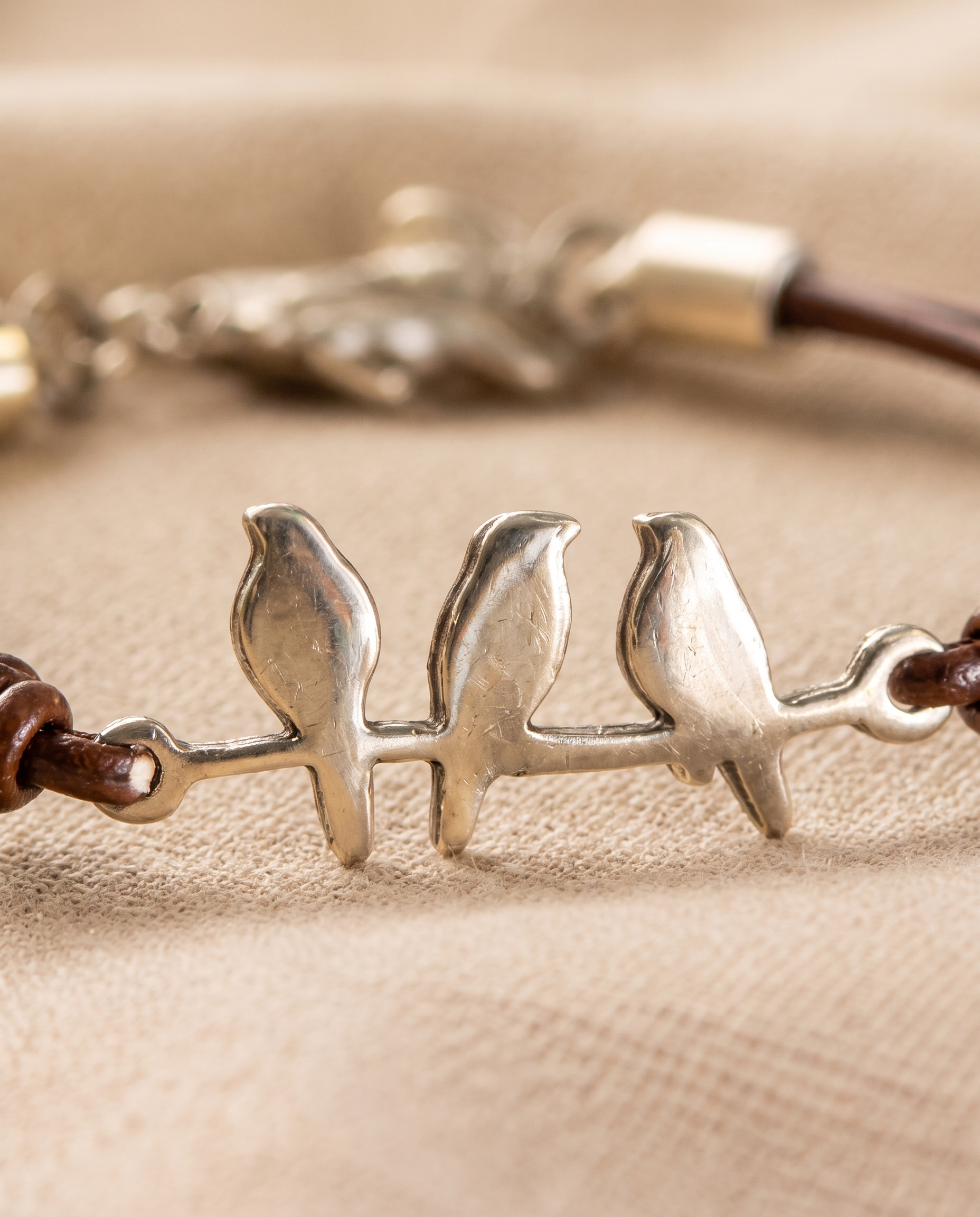 Bird Branch Leather Bracelet three-bird charm close up