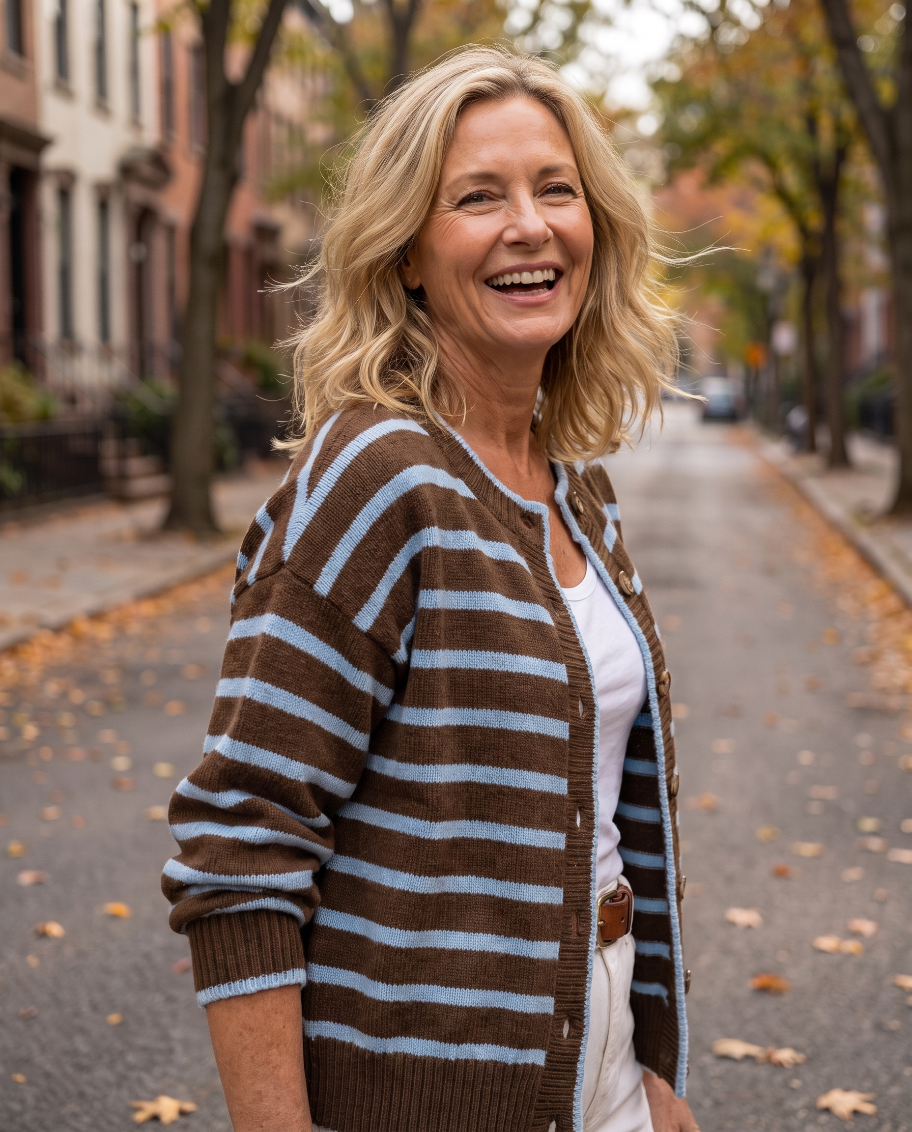 Woman in her 50s wearing the Anabel Striped Knit Cardigan in Brown Baby Blue