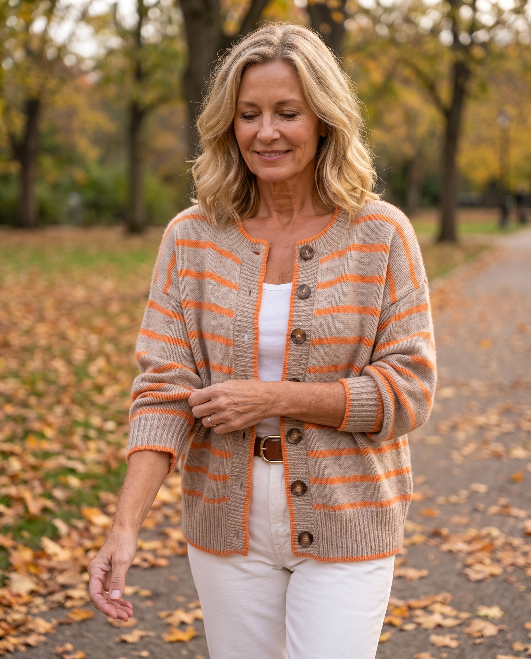 Woman in her 50s wearing the Anabel Striped Knit Cardigan for Women, Beige Orange colourway