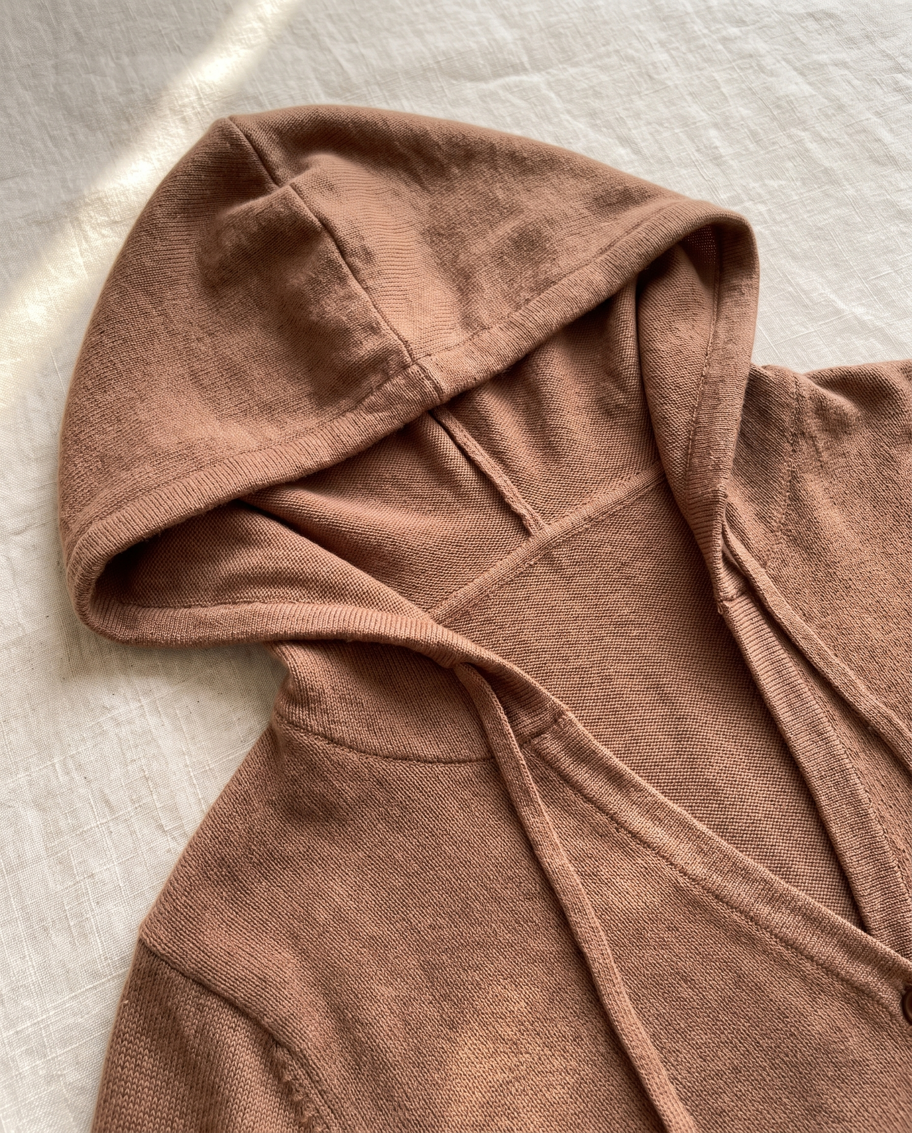 Close-up of the hood and drawstring on the Nora Cappuccino Hooded Cardigan