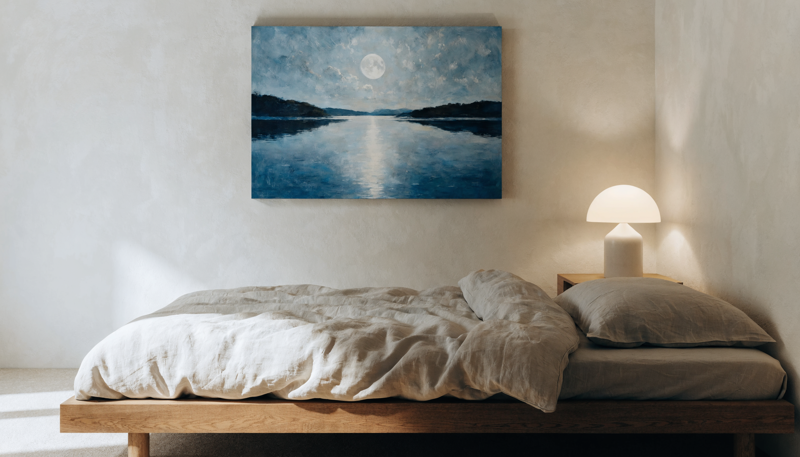 Minimalist bedroom interior with a large calming moonlit lake print above the bed — correct size and placement for restorative bedroom art