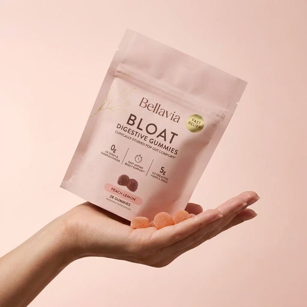 Bellavia BLOAT gummies held in hand
