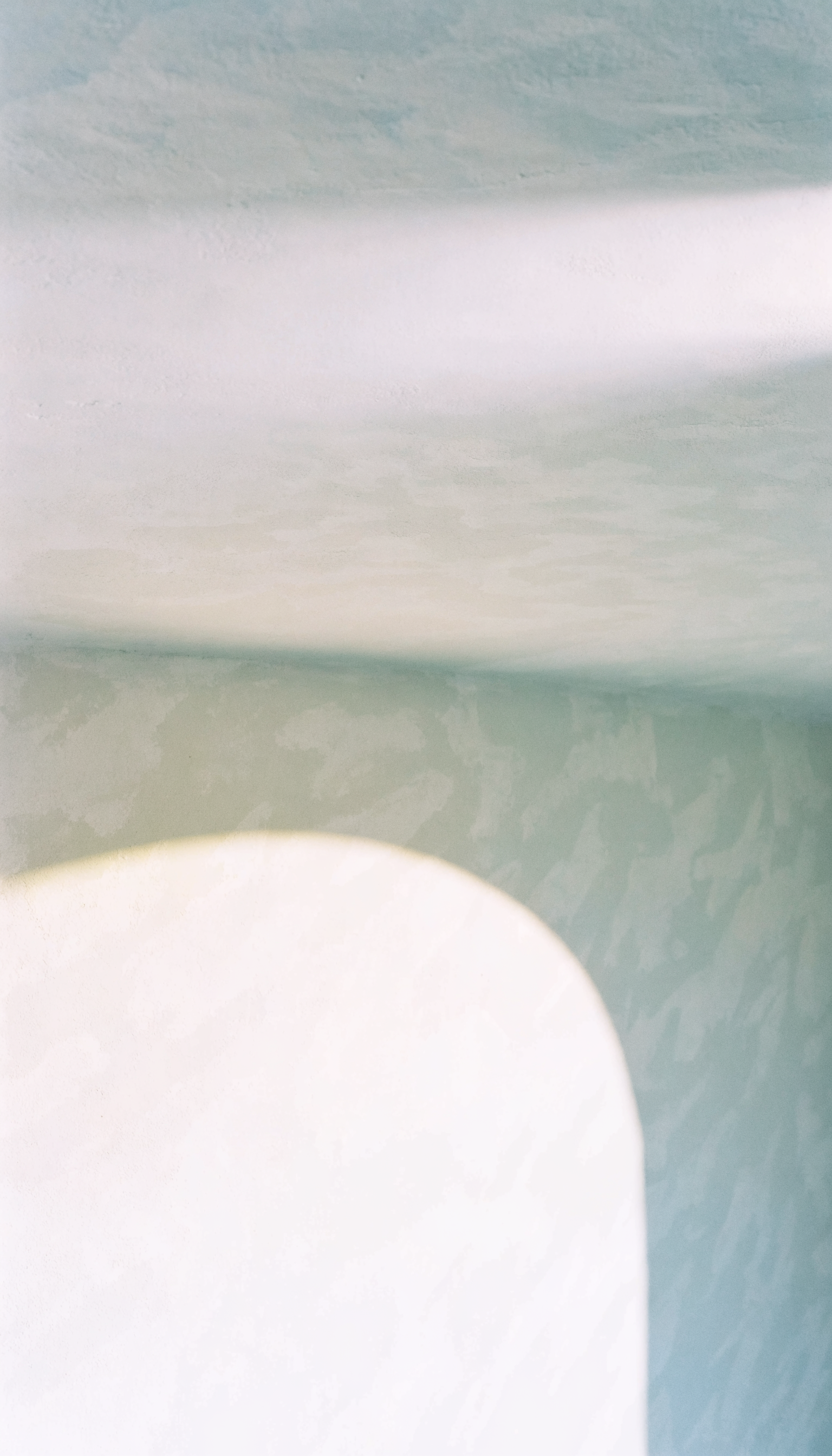 Soft daylight through fluted glass — abstract architectural photography
