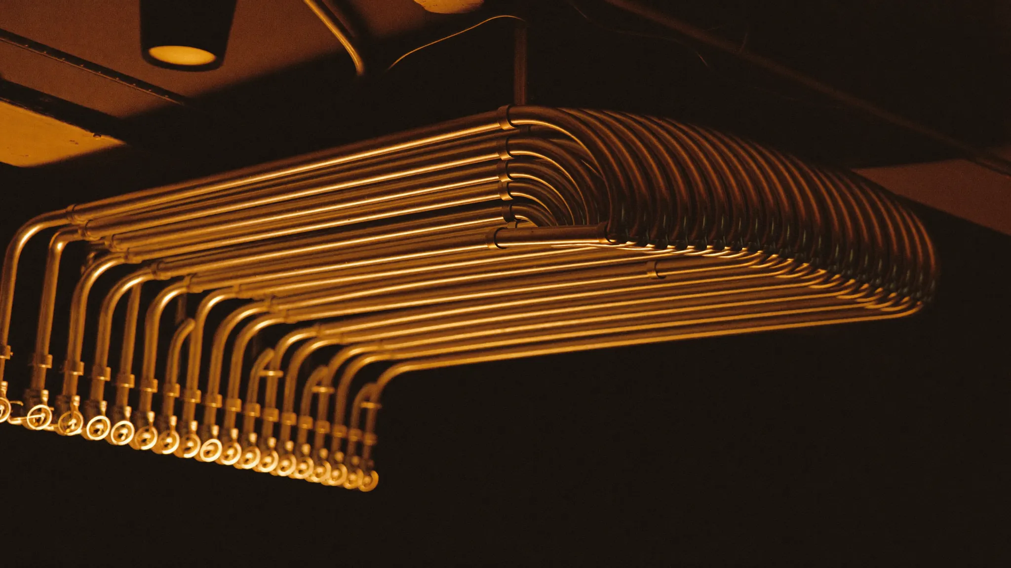 Parallel EMT conduit runs feeding a commercial distribution panel