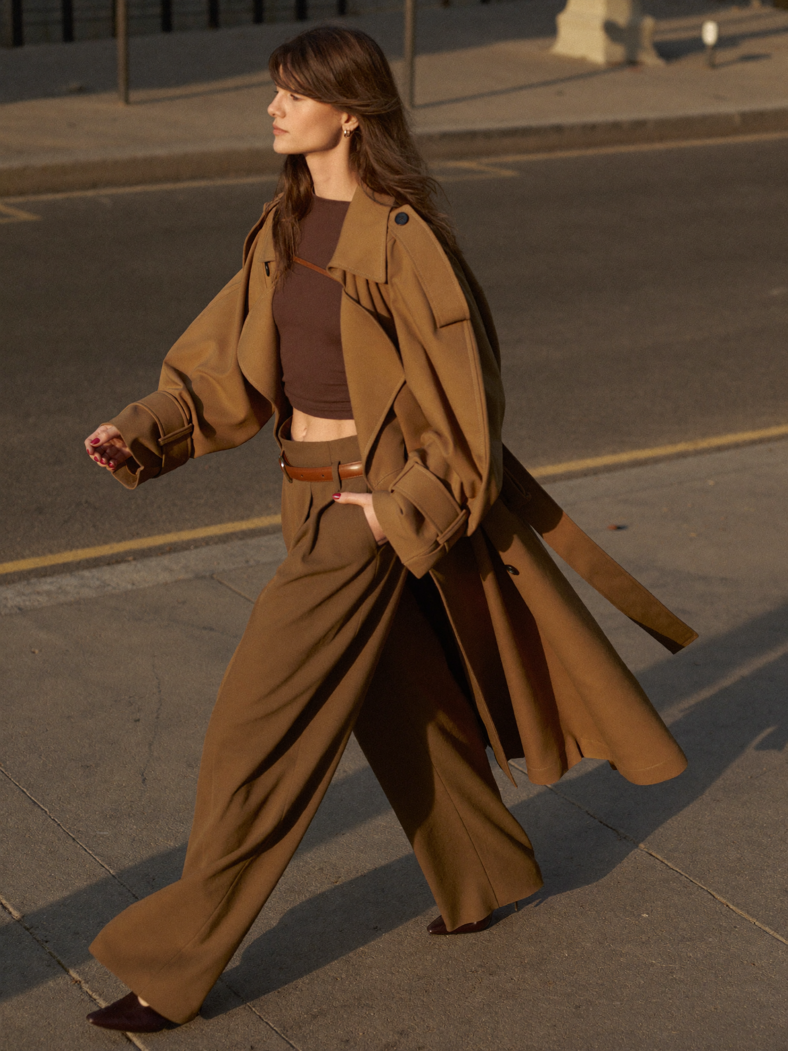 Woman in a camel trench coat, street style editorial