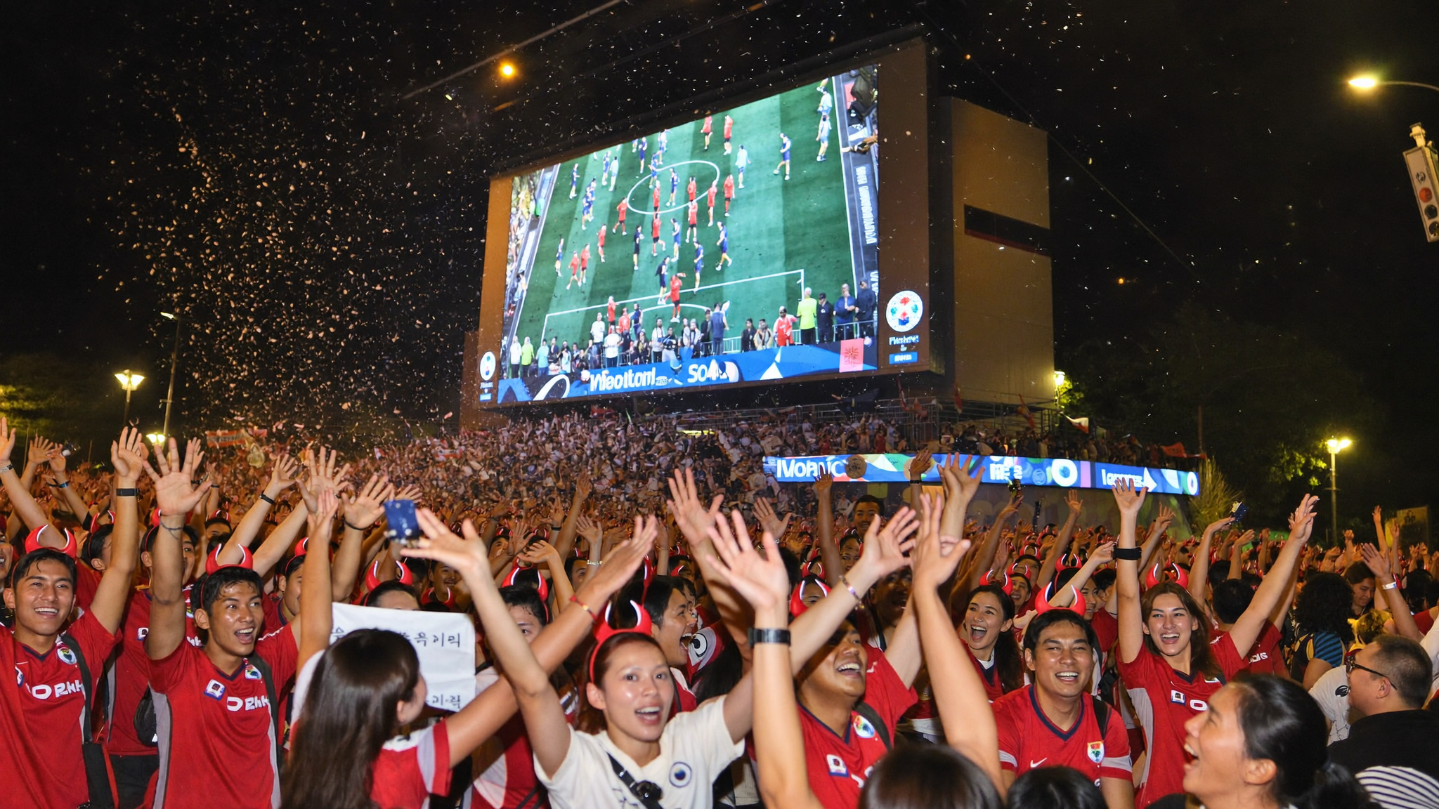 Korean fans celebrating the Korea World Cup 2026 comeback win over Czechia at a street viewing party