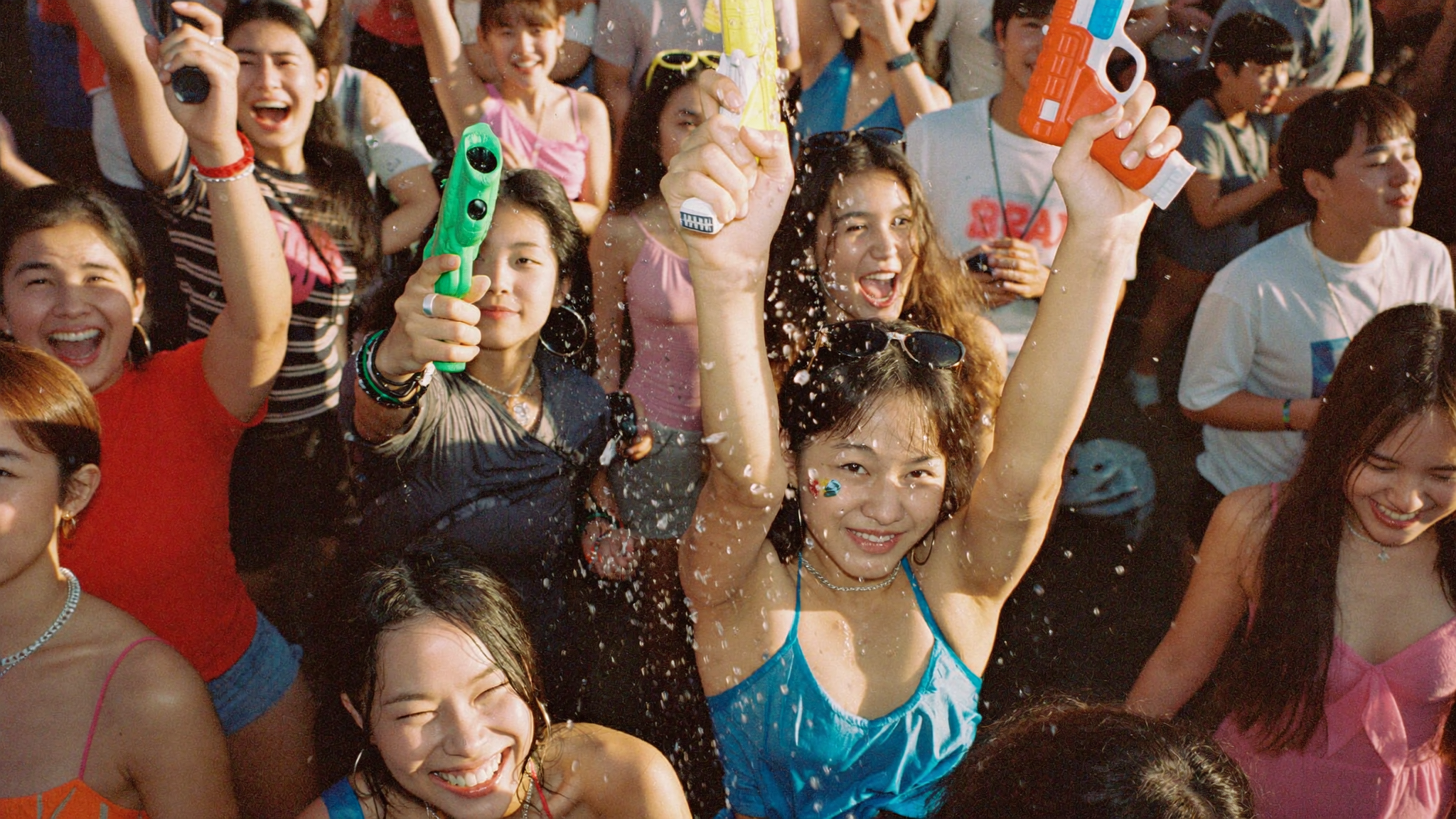 Festival goers in a water gun battle at Korean summer festival WATERBOMB Seoul 2026