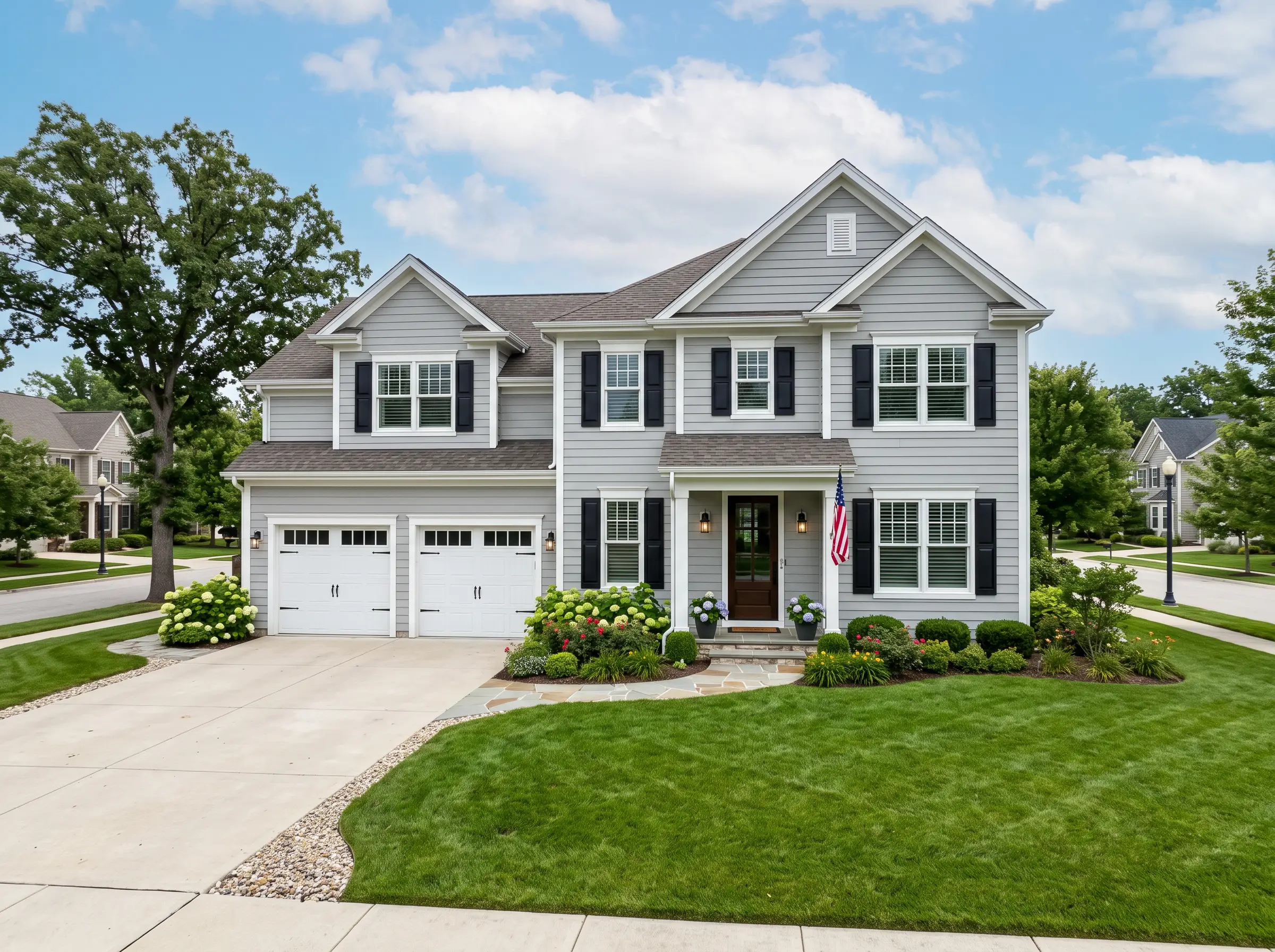 Same home with new gray siding after Ironhorse Exteriors