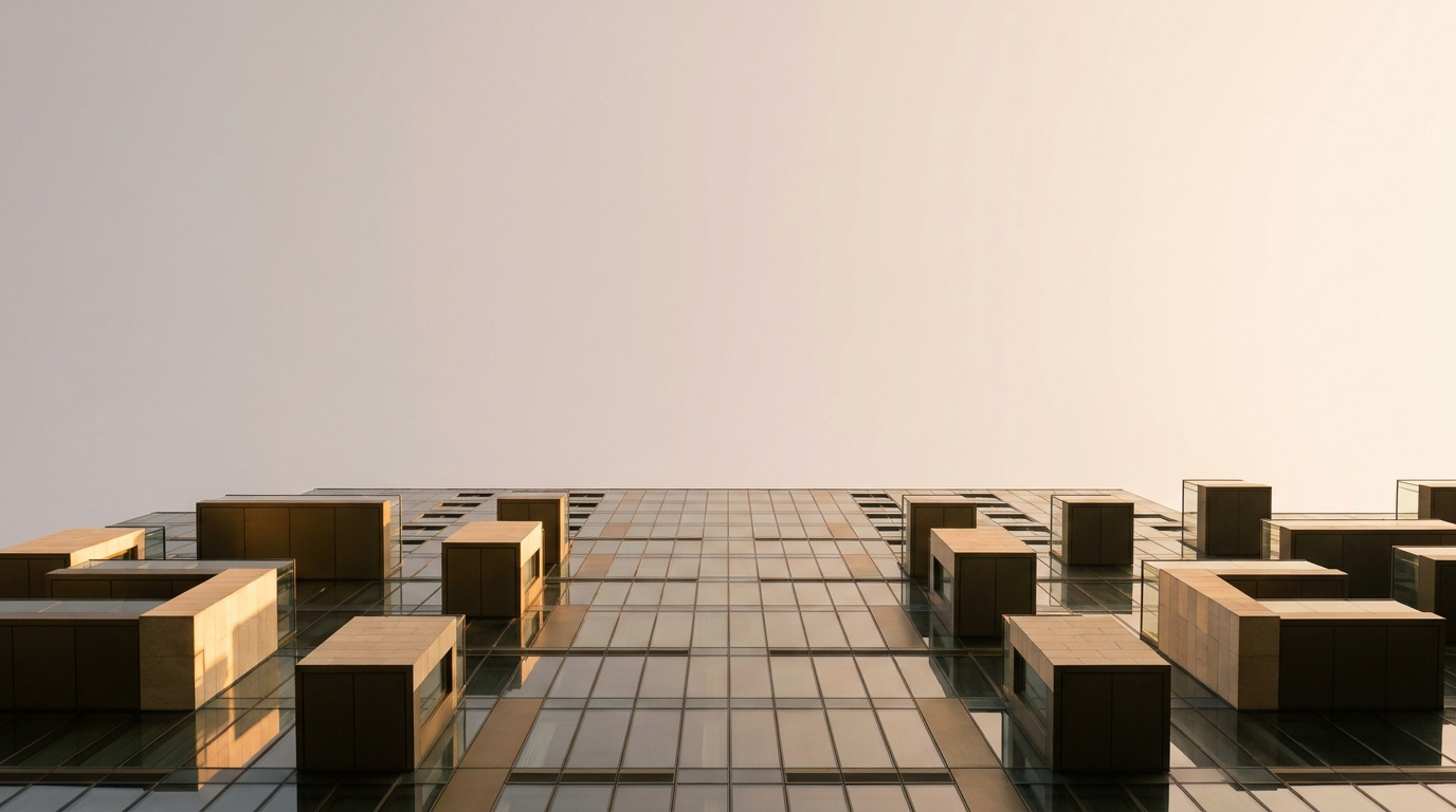A modern glass residential tower at golden hour