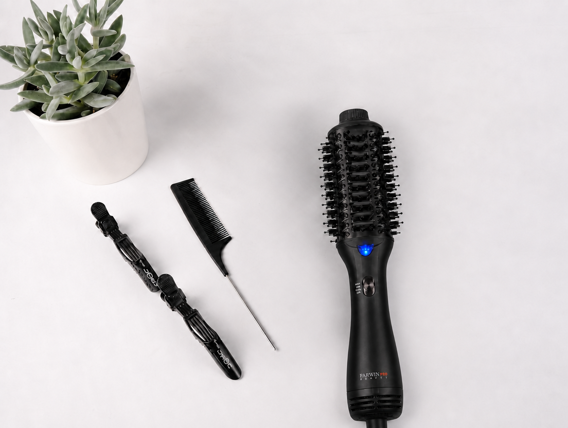 Parwin Pro Beauty Aurora Styler Blow Brush alongside styling accessories on a flat surface