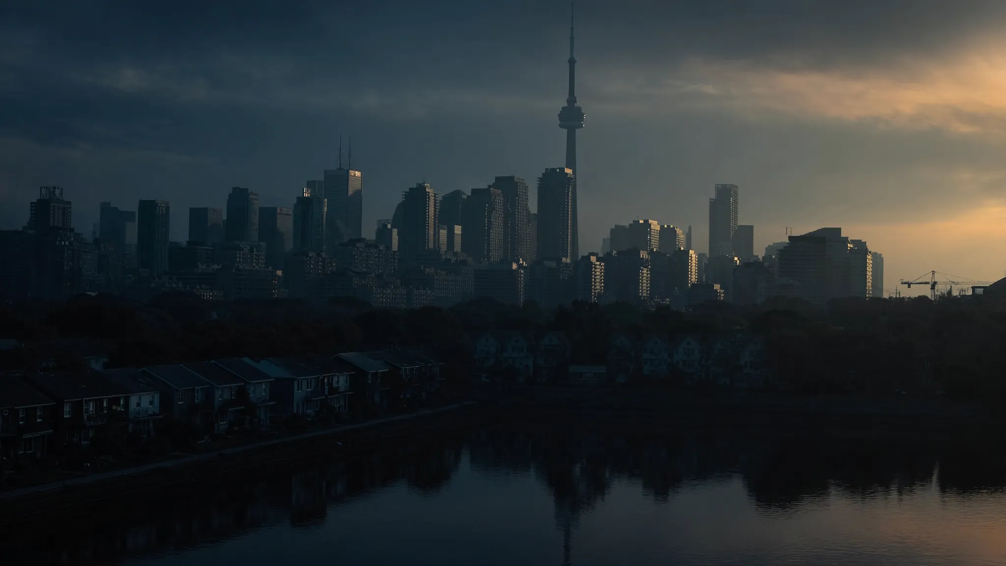 Toronto skyline with CN Tower at dusk from the waterfront