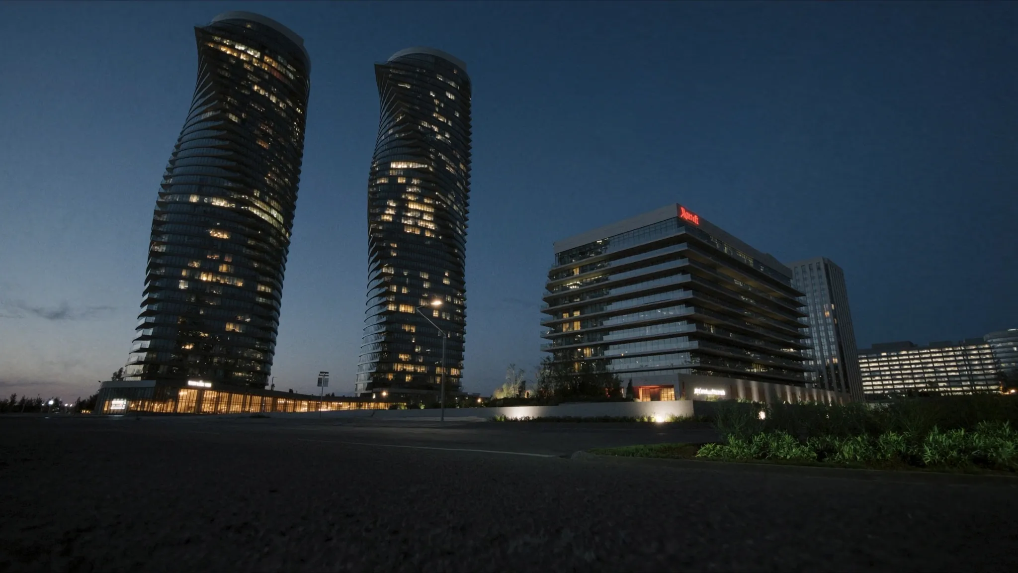 Modern condo towers in Mississauga City Centre near Square One at dusk