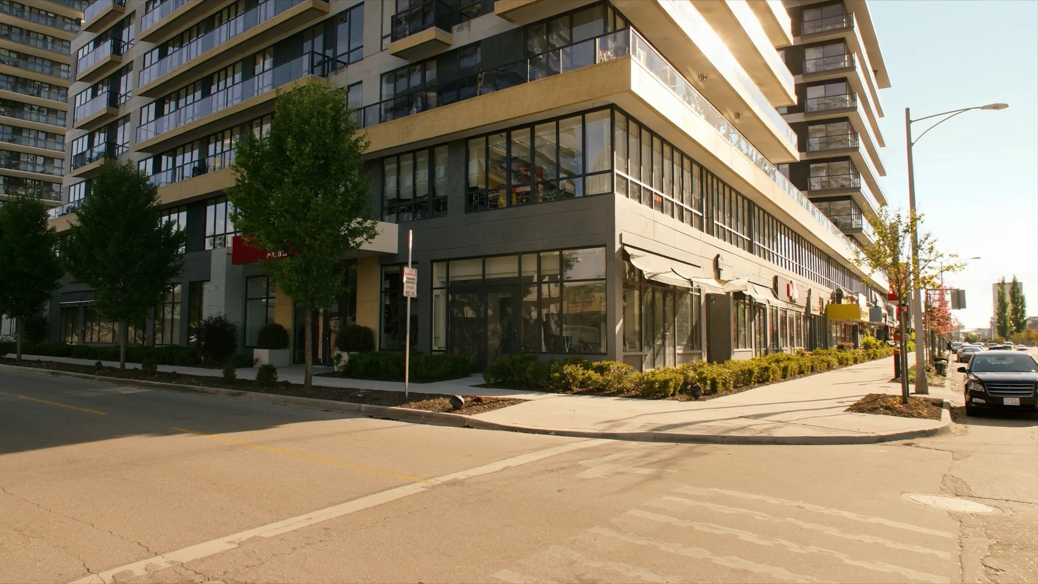 Modern midrise condos with street-level retail on The Queensway in Etobicoke
