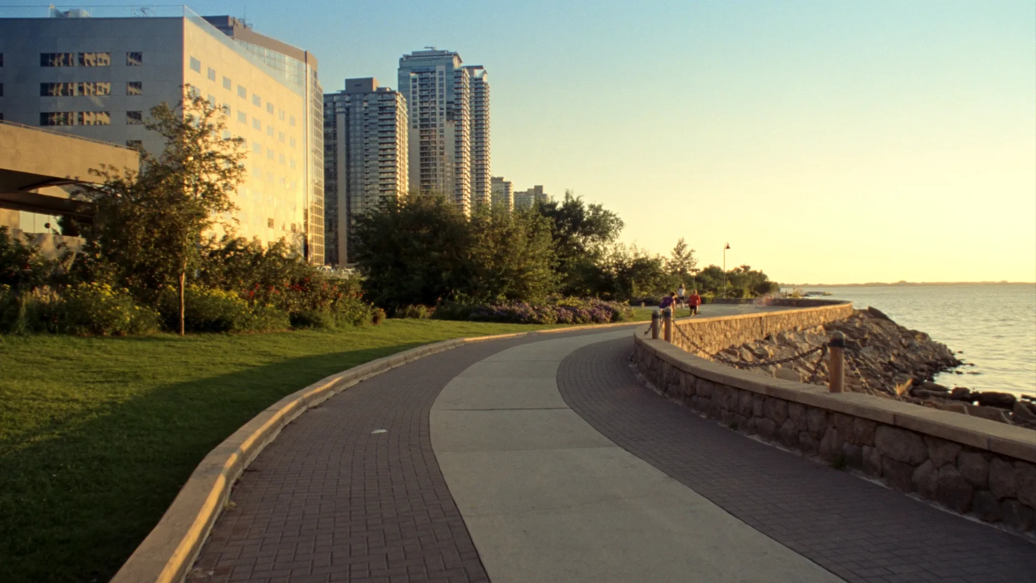 Humber Bay Shores waterfront trail with condo towers at golden hour in Etobicoke