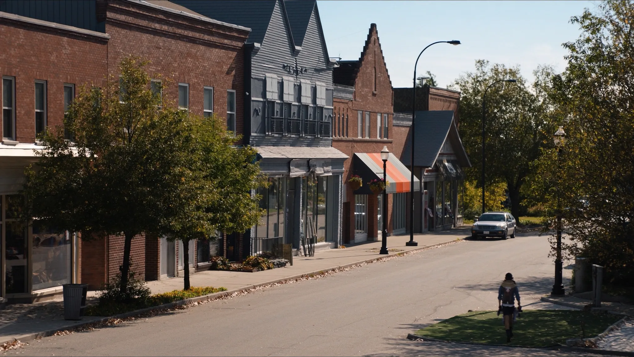 Mimico village street with shops and mature trees in Etobicoke