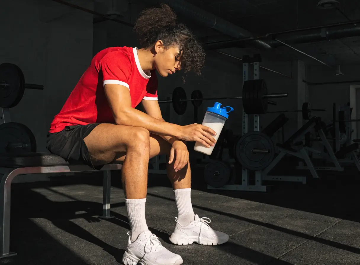 Athlete with a protein shaker