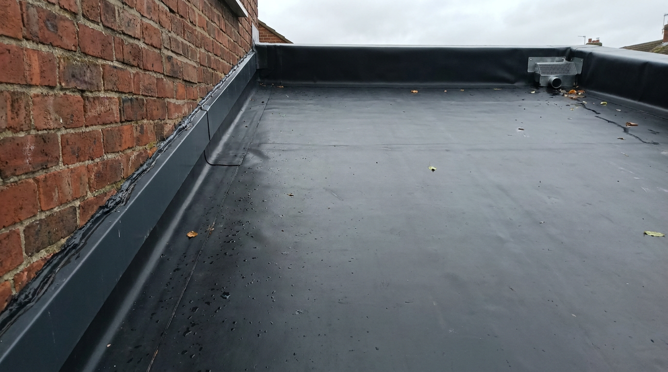 EPDM in one piece on an extension, upstand and termination bar against the wall