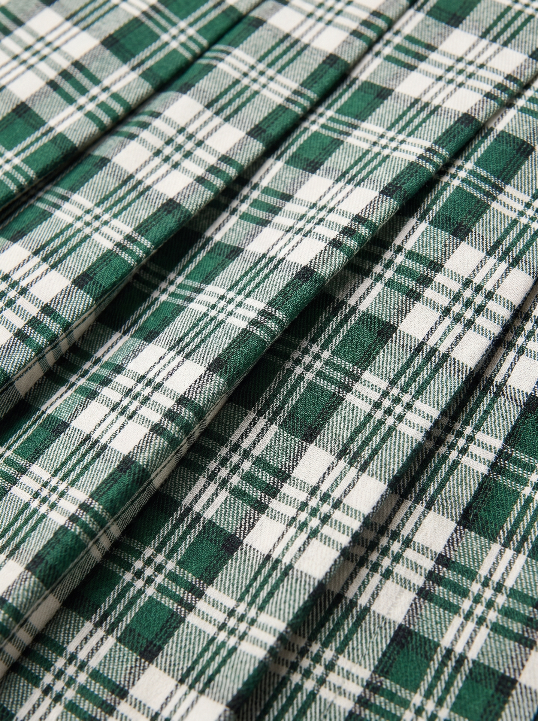 Pleated mini skirt check pattern and pleats close up detail