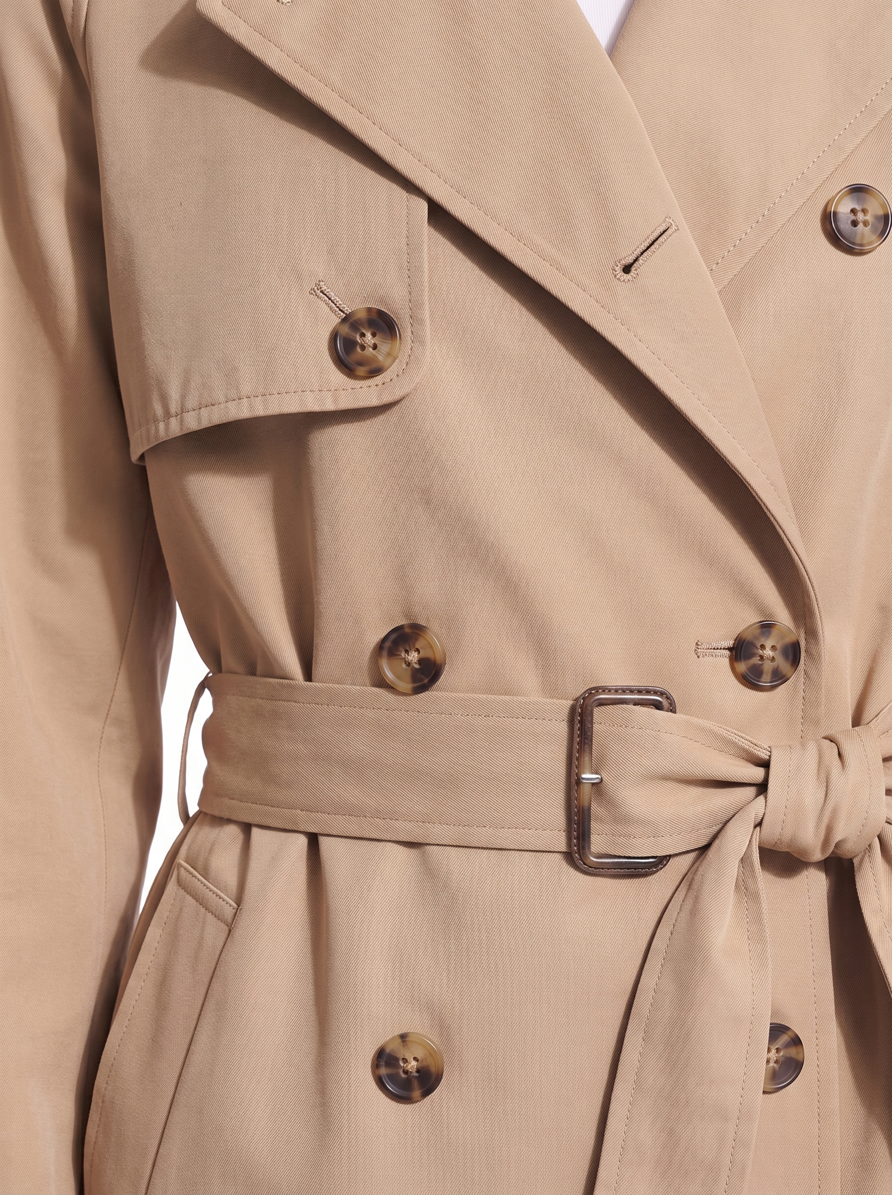 Trench coat buttons storm flap and belt close up detail