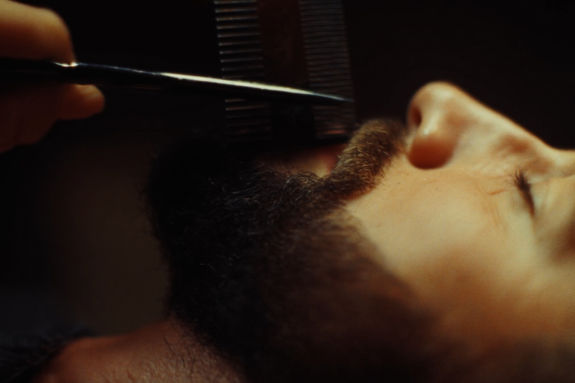 Detailed beard trimming with scissors and comb