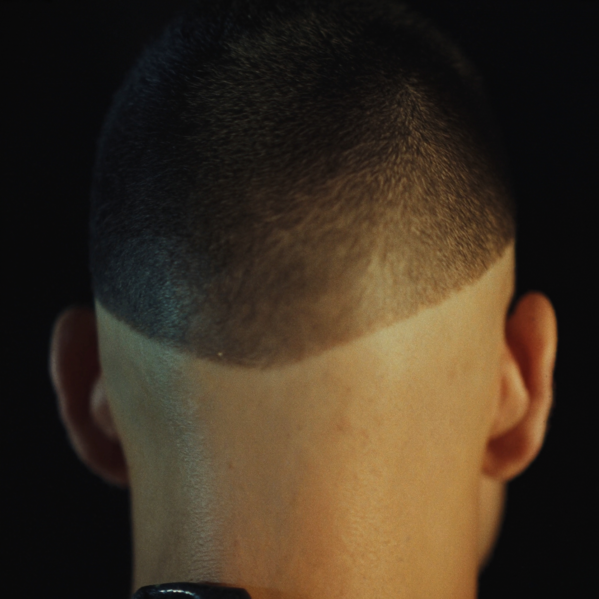 DeShawn's work — a razor-sharp skin fade from the back