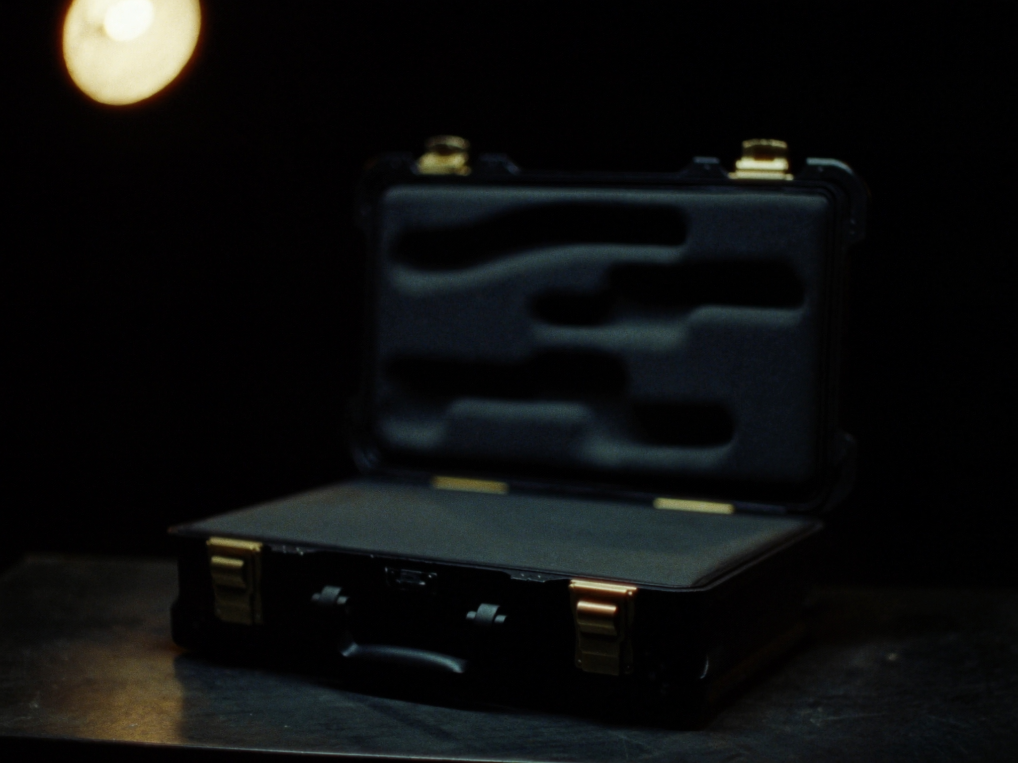 Open hard case with cut foam interior, ready for a firearm transfer