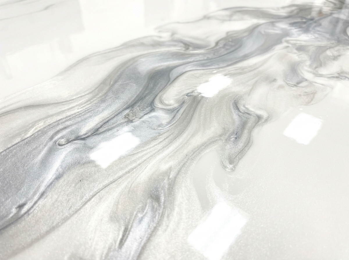 Arctic Pearl metallic epoxy floor — white, pearl, and silver swirl