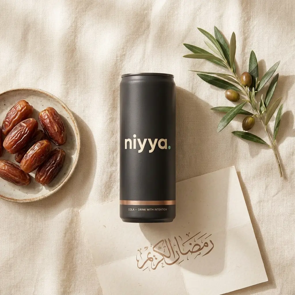 niyya cola flat-lay with dates, olive branch and Arabic calligraphy