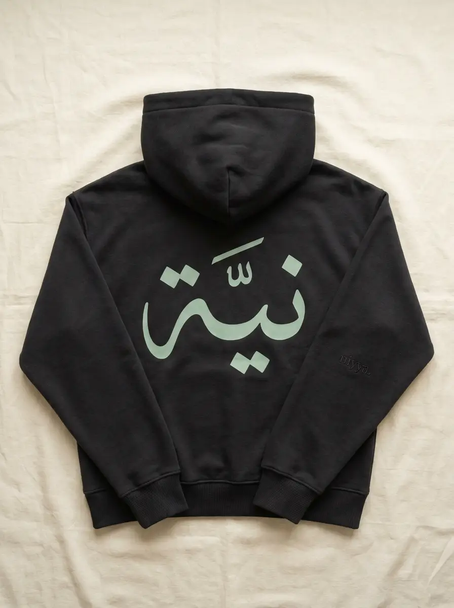 charcoal niyya hoodie with mint نيّة calligraphy back print, flat-lay