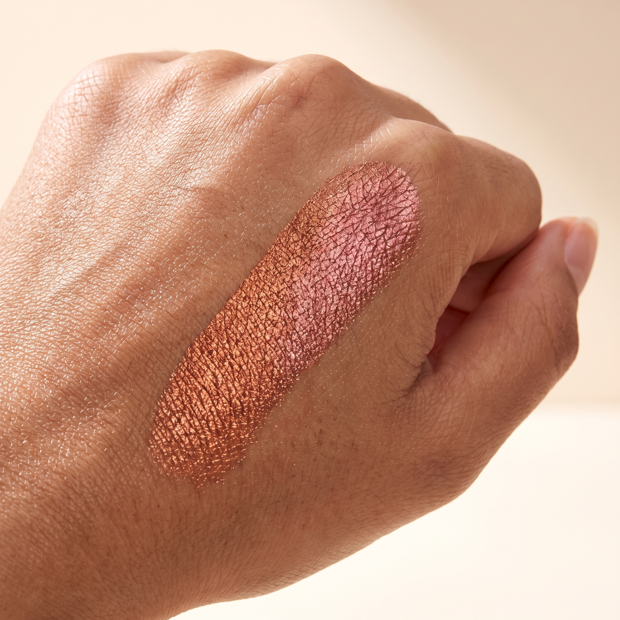 ChromaTap color-shift swatch on hand