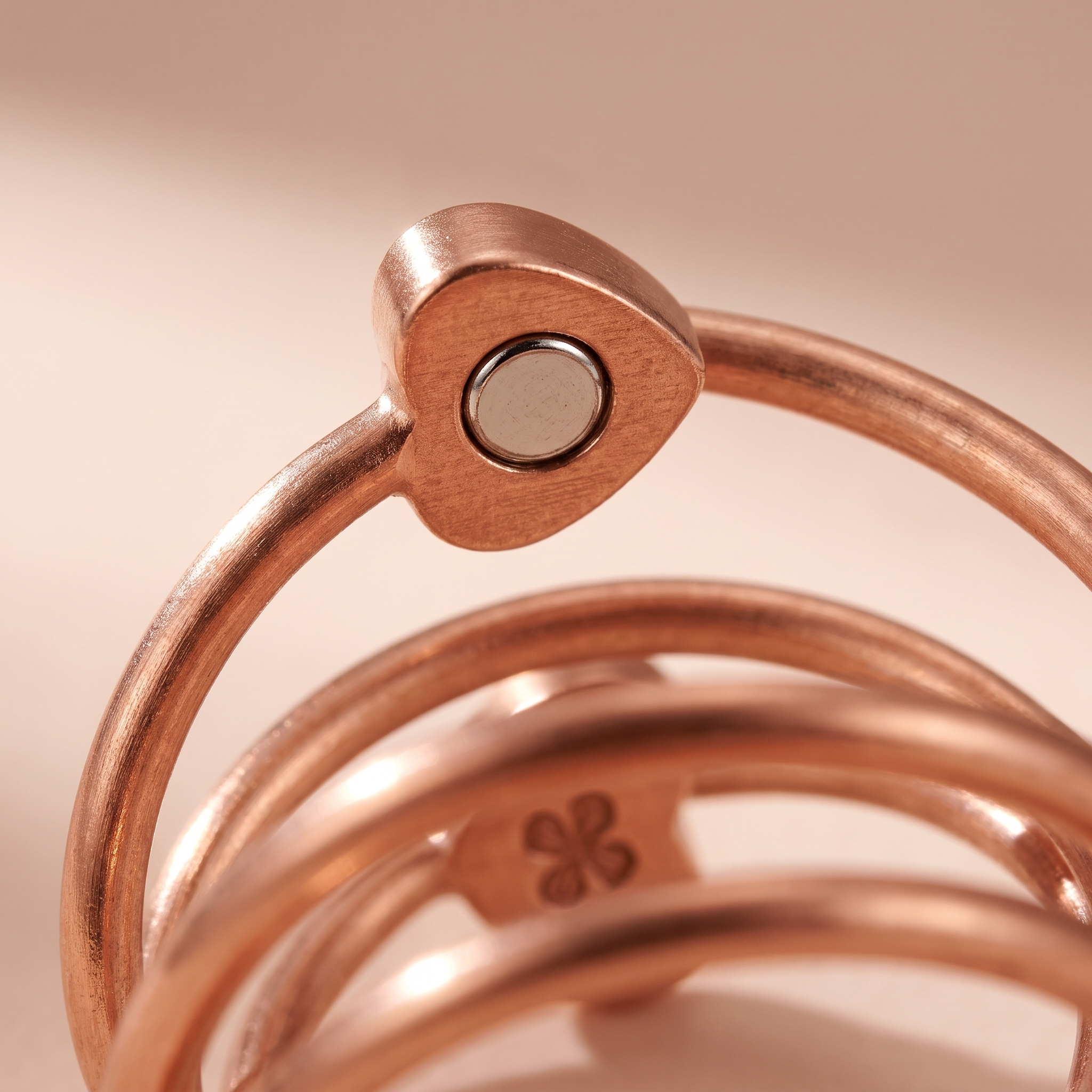Close-up of the embedded magnet in the ring's heart-shaped cap