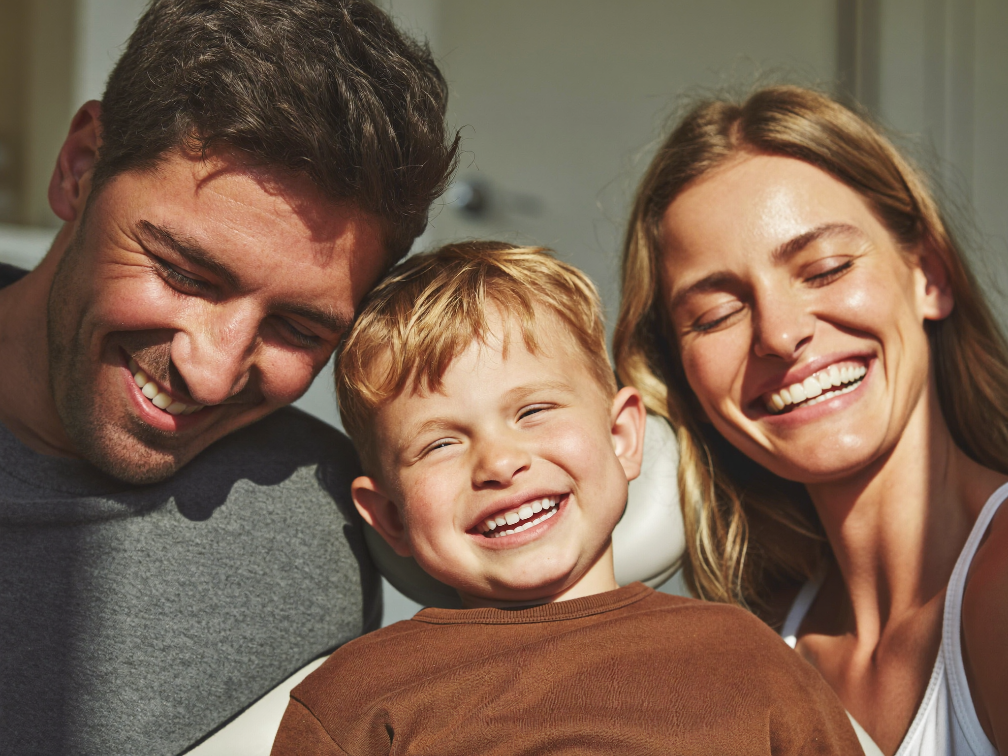 Happy family smiling and laughing together