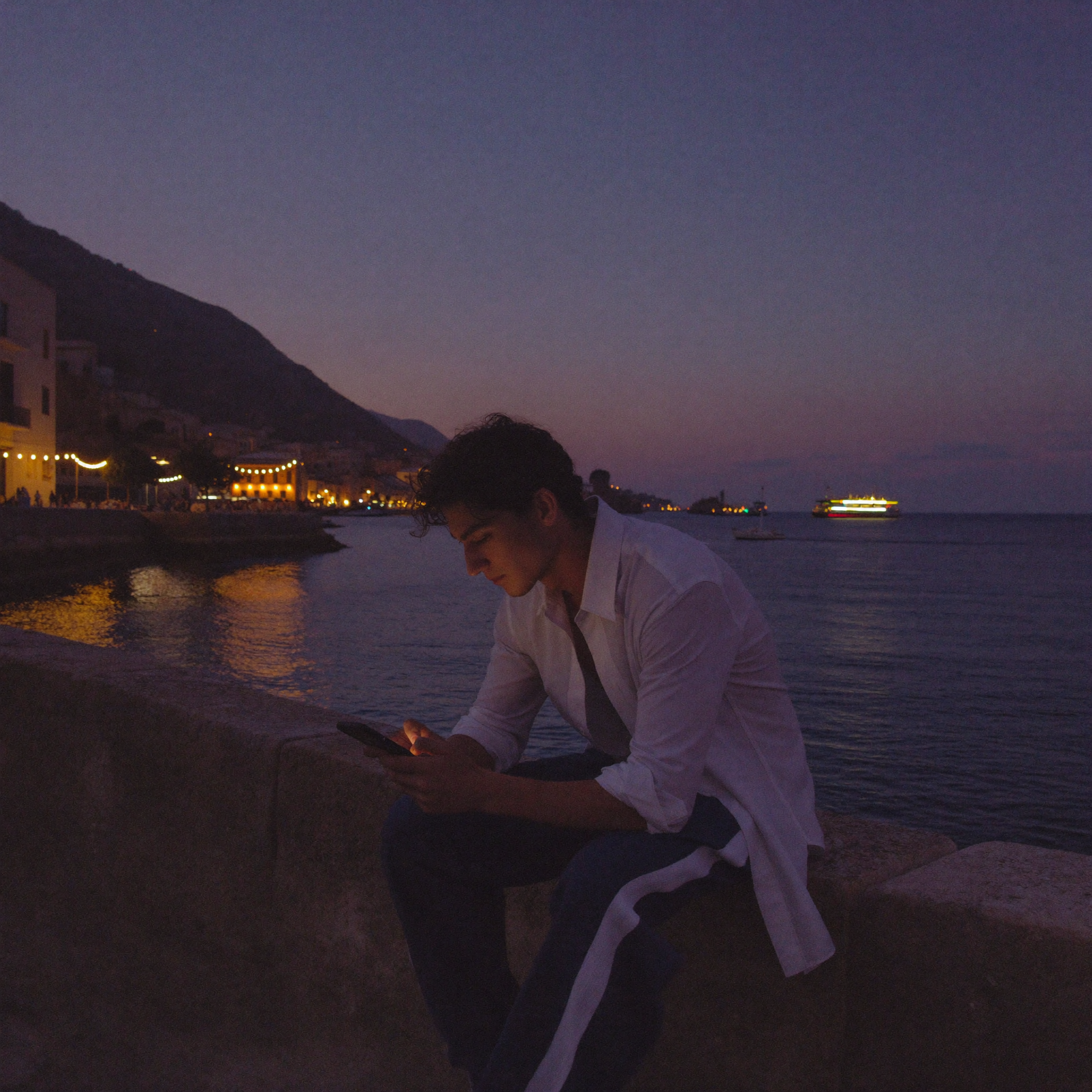 Him - harbor wall at blue hour, typing