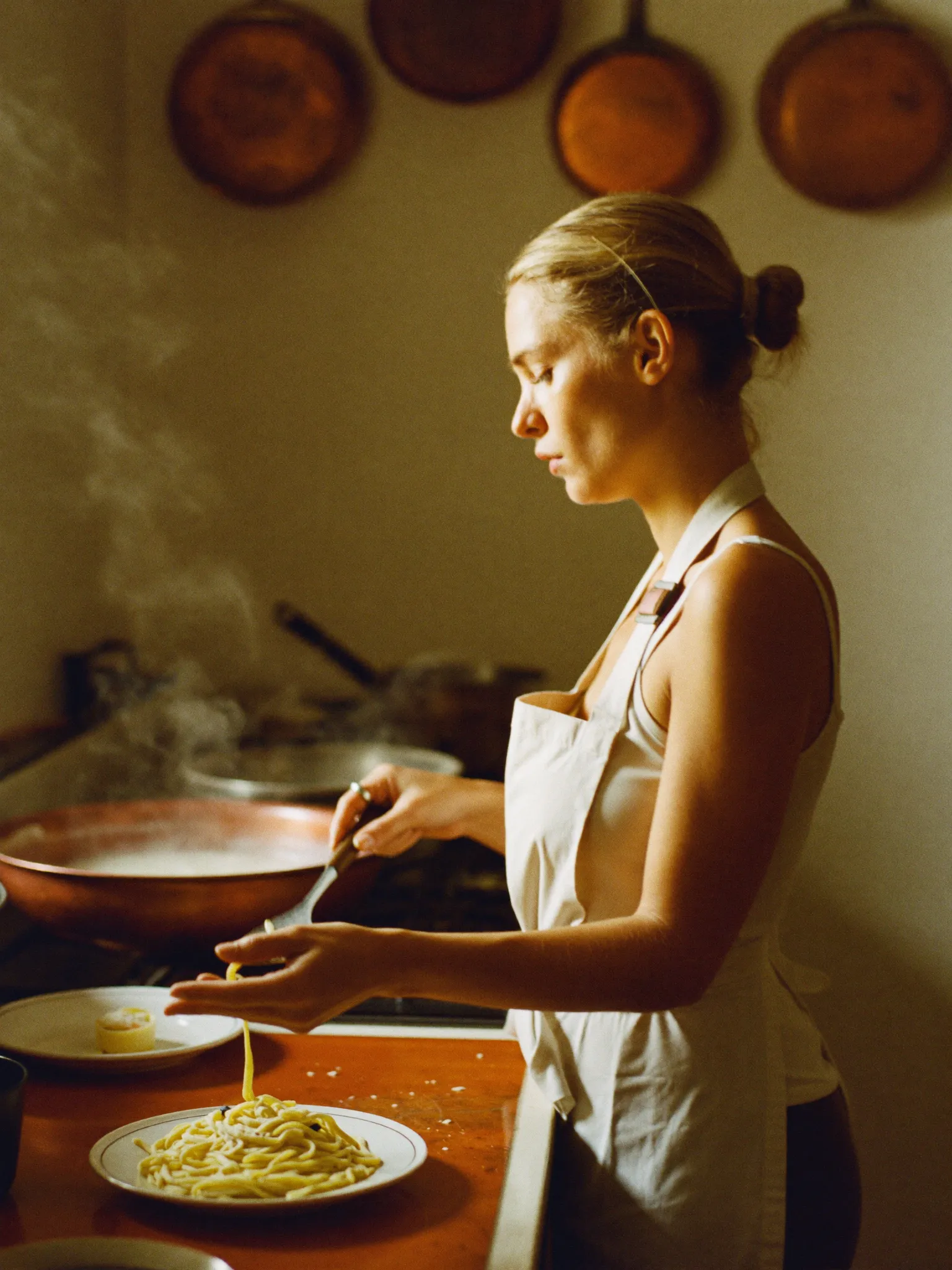 Chef Elena plating at the pass