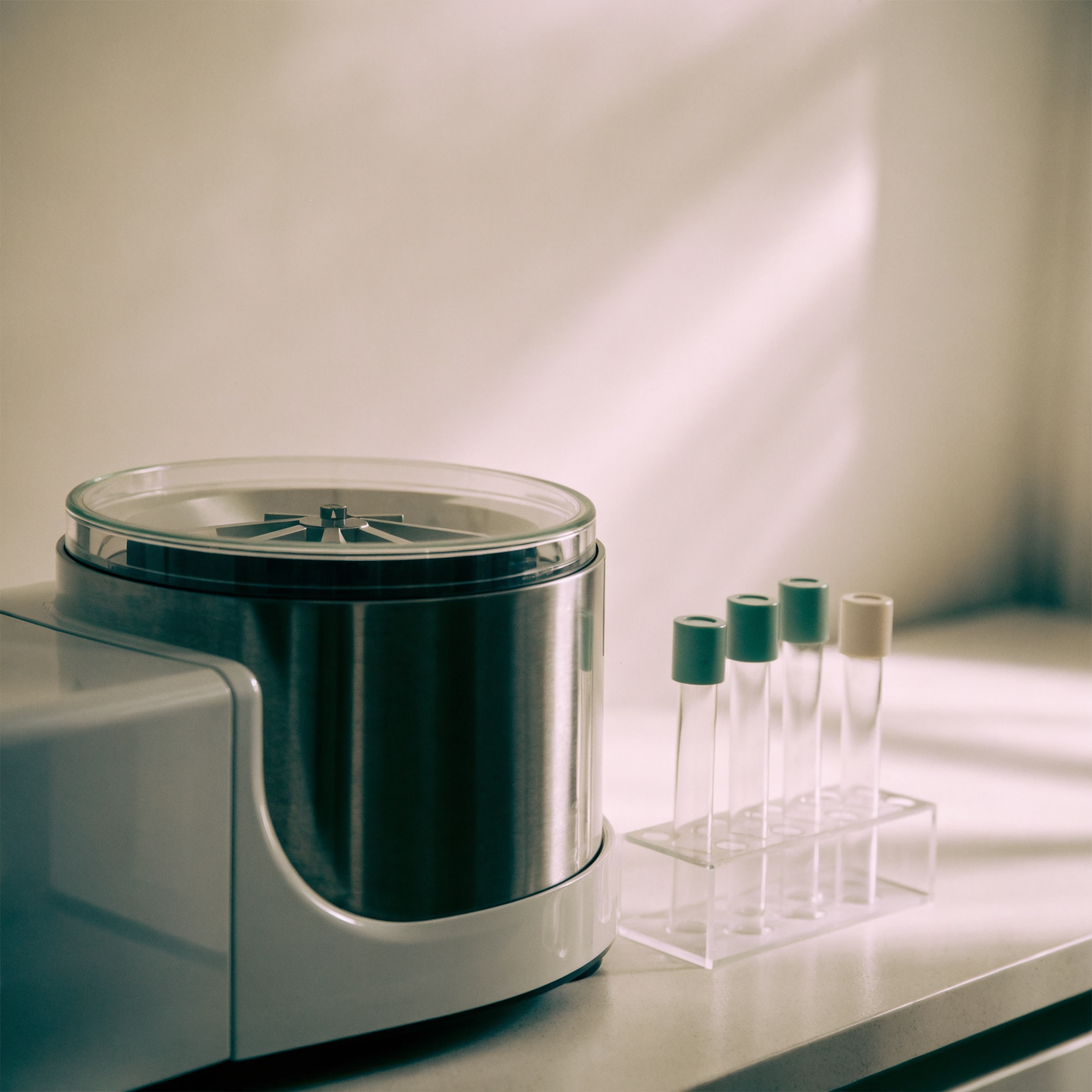 A benchtop centrifuge on a clinic counter